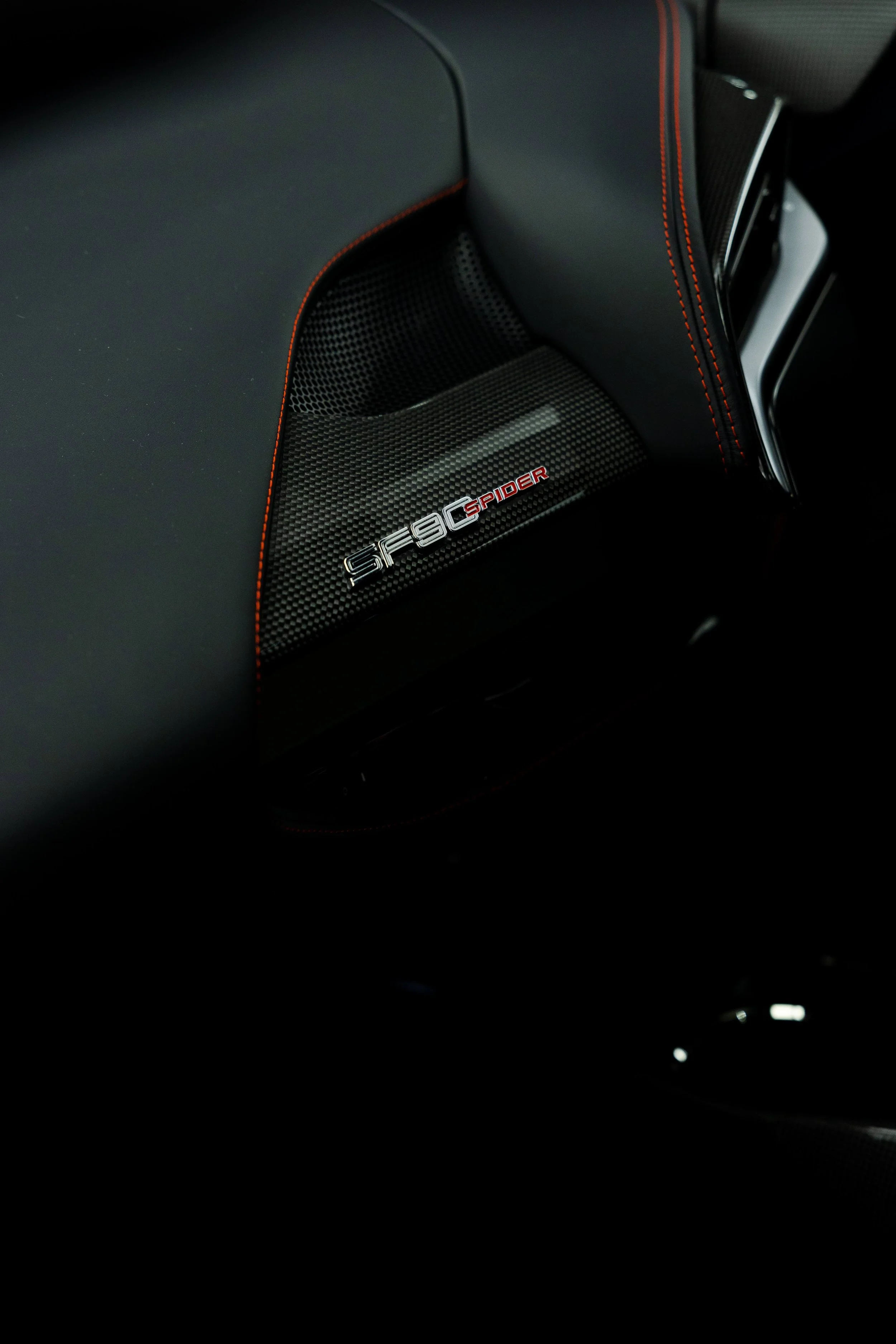 Red Ferrari SF90 Spyder interior detailing SF90 Spider carbon trim badge in Mona Vale