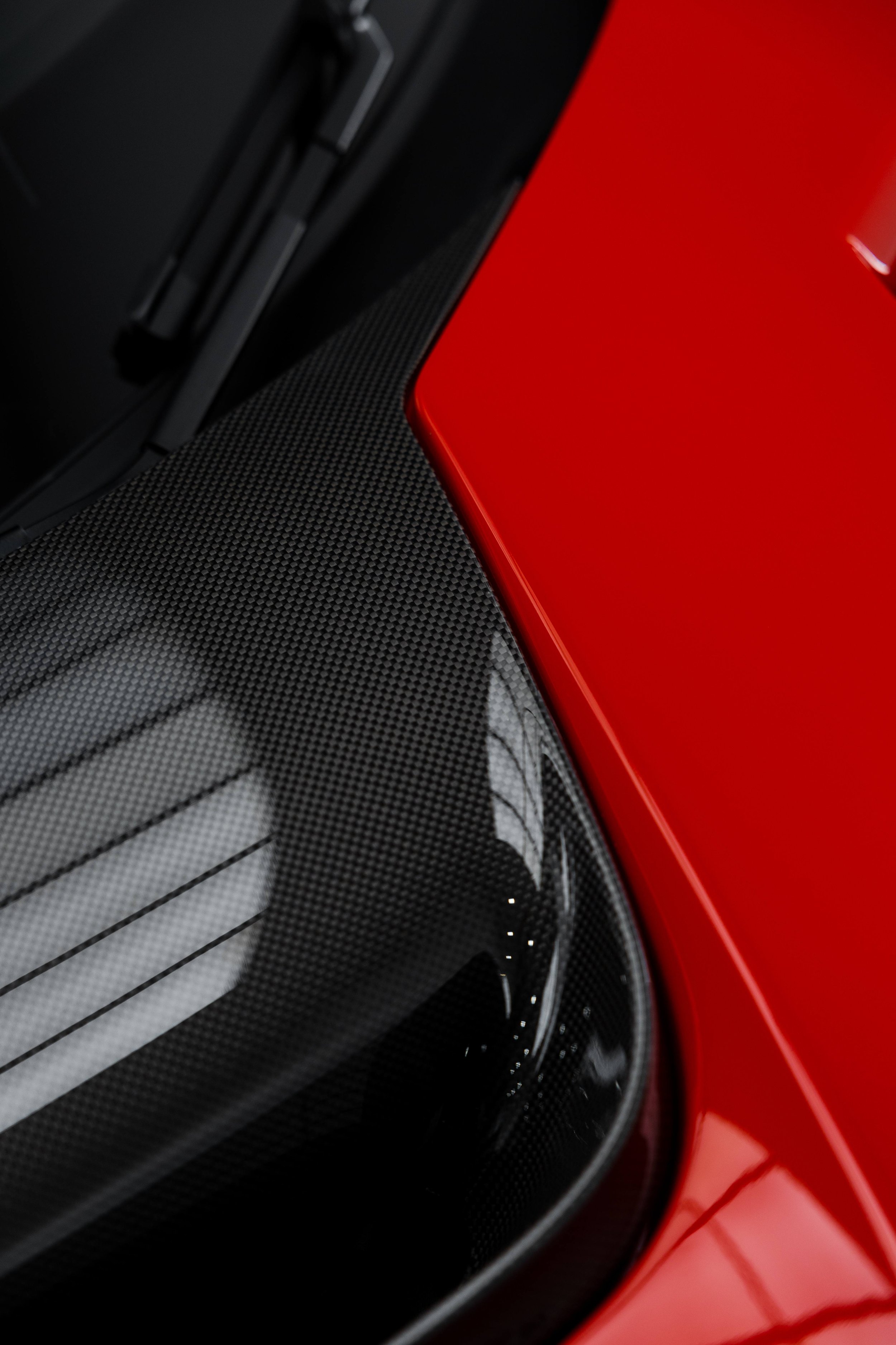 Red Ferrari 296 Speciale carbon cowl and bonnet edge close up with XPEL Paint Protection Film in Sydney