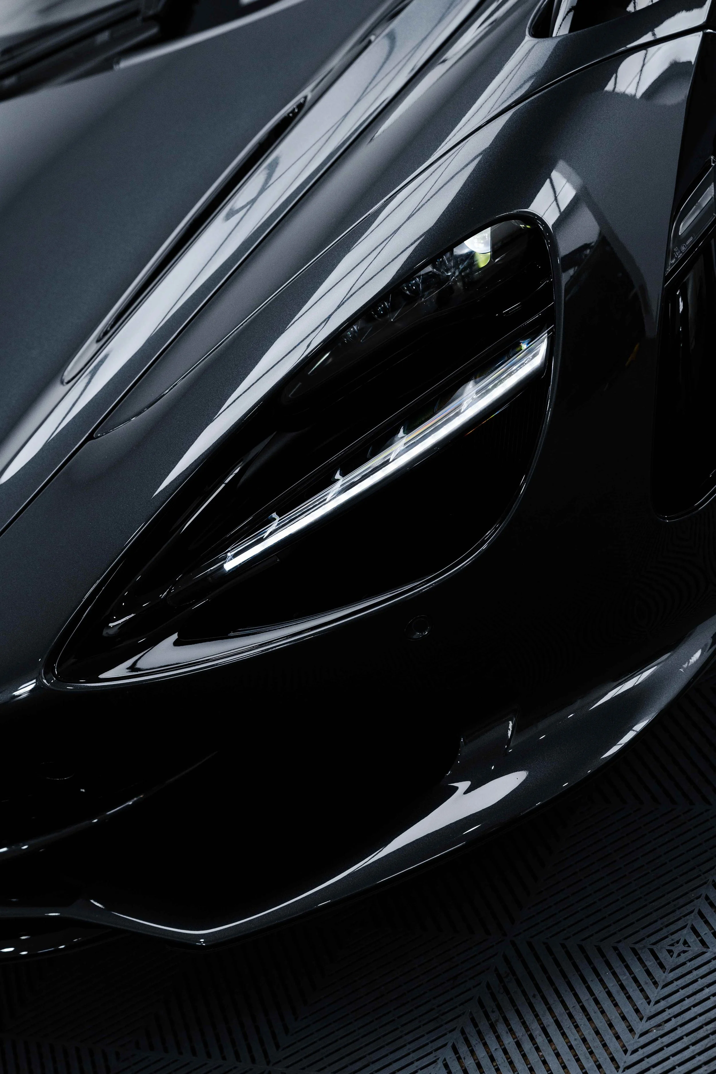 Black McLaren 750S front headlight and vent detail with XPEL Paint Protection Film in Sydney