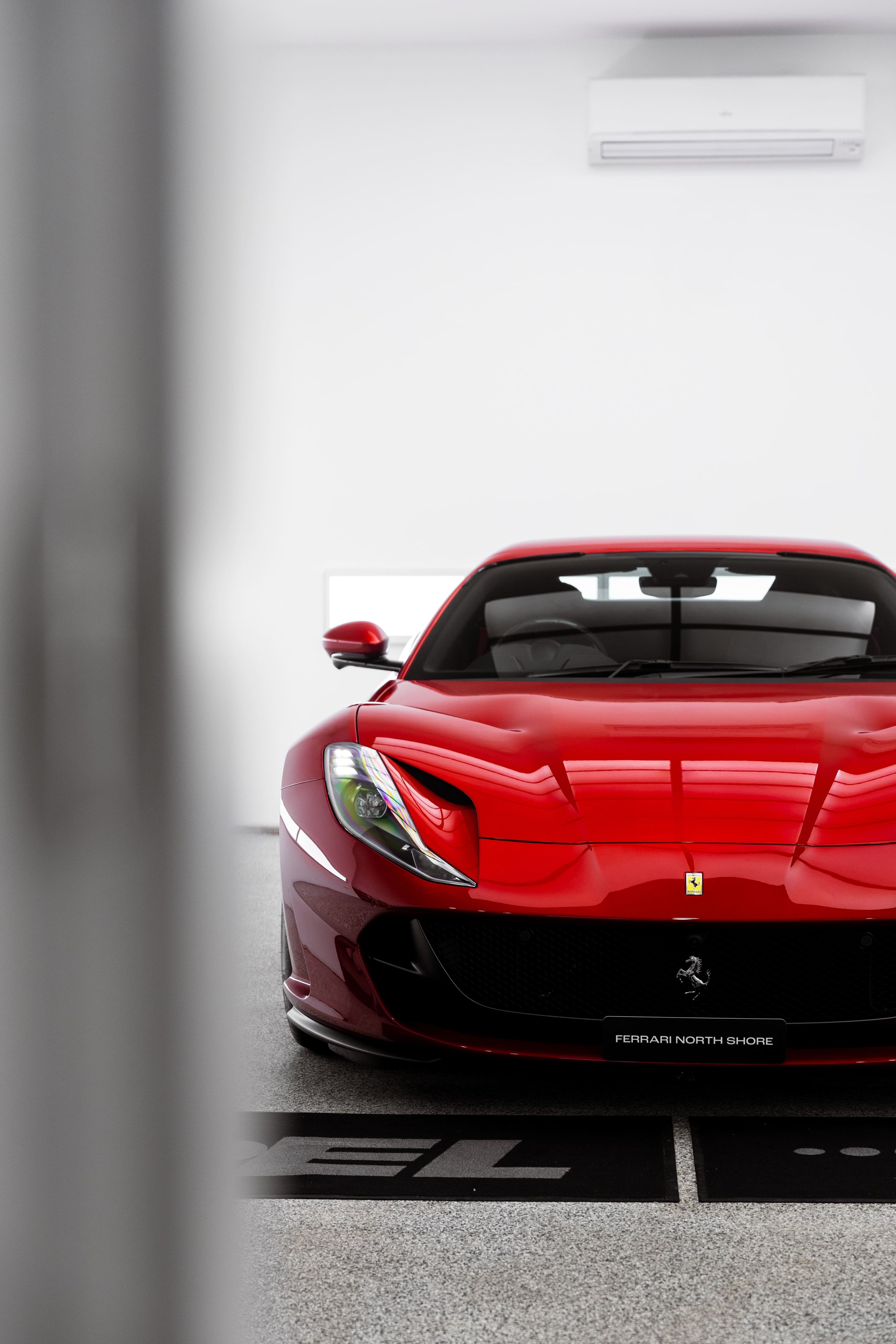 Red Ferrari 812 GTS front view with gloss paint finish protected by PPF and ceramic coating by ADS in Sydney