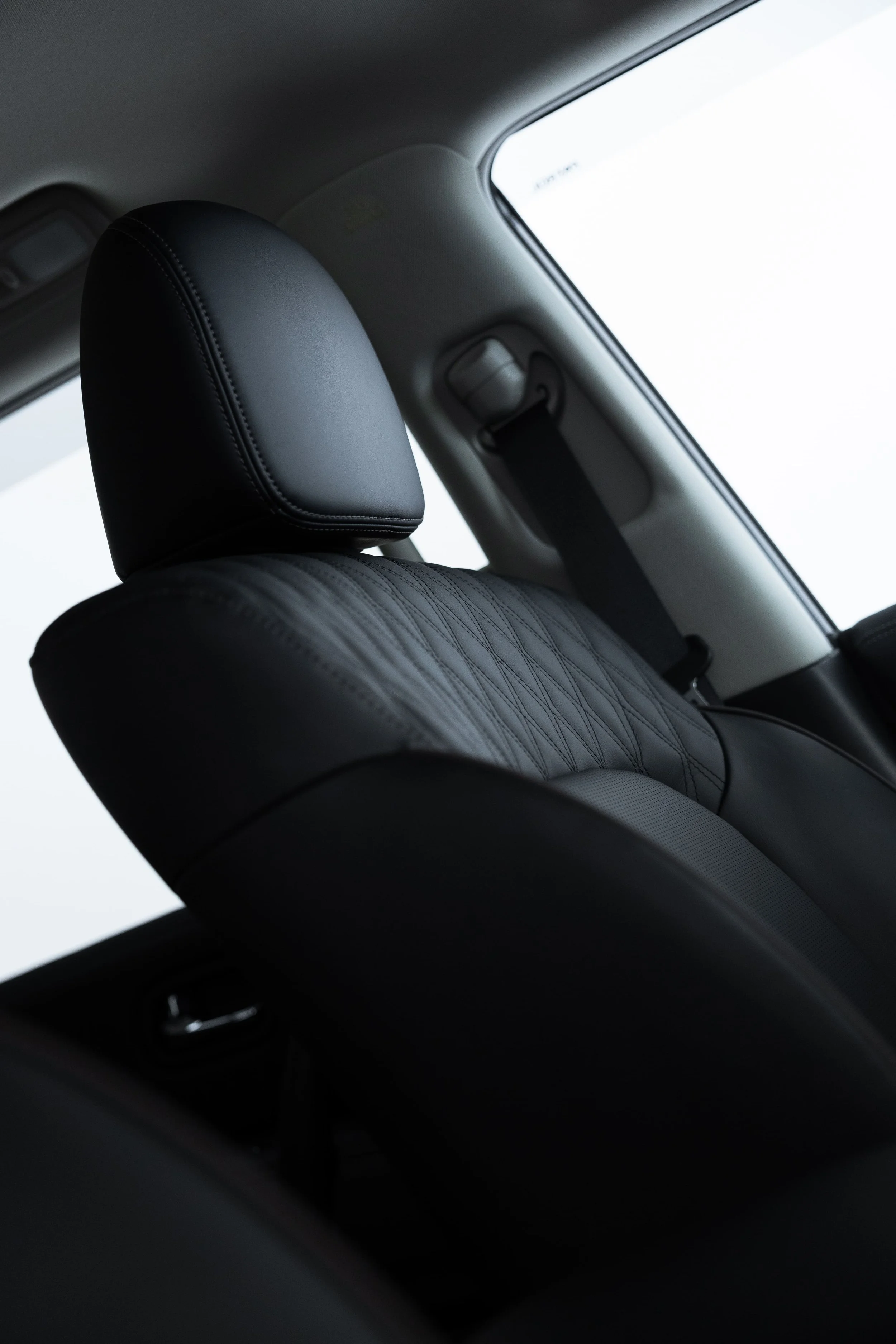 Front passenger seat of Y62 Nissan Patrol with stitched leather interior after detailing by ADS in Sydney