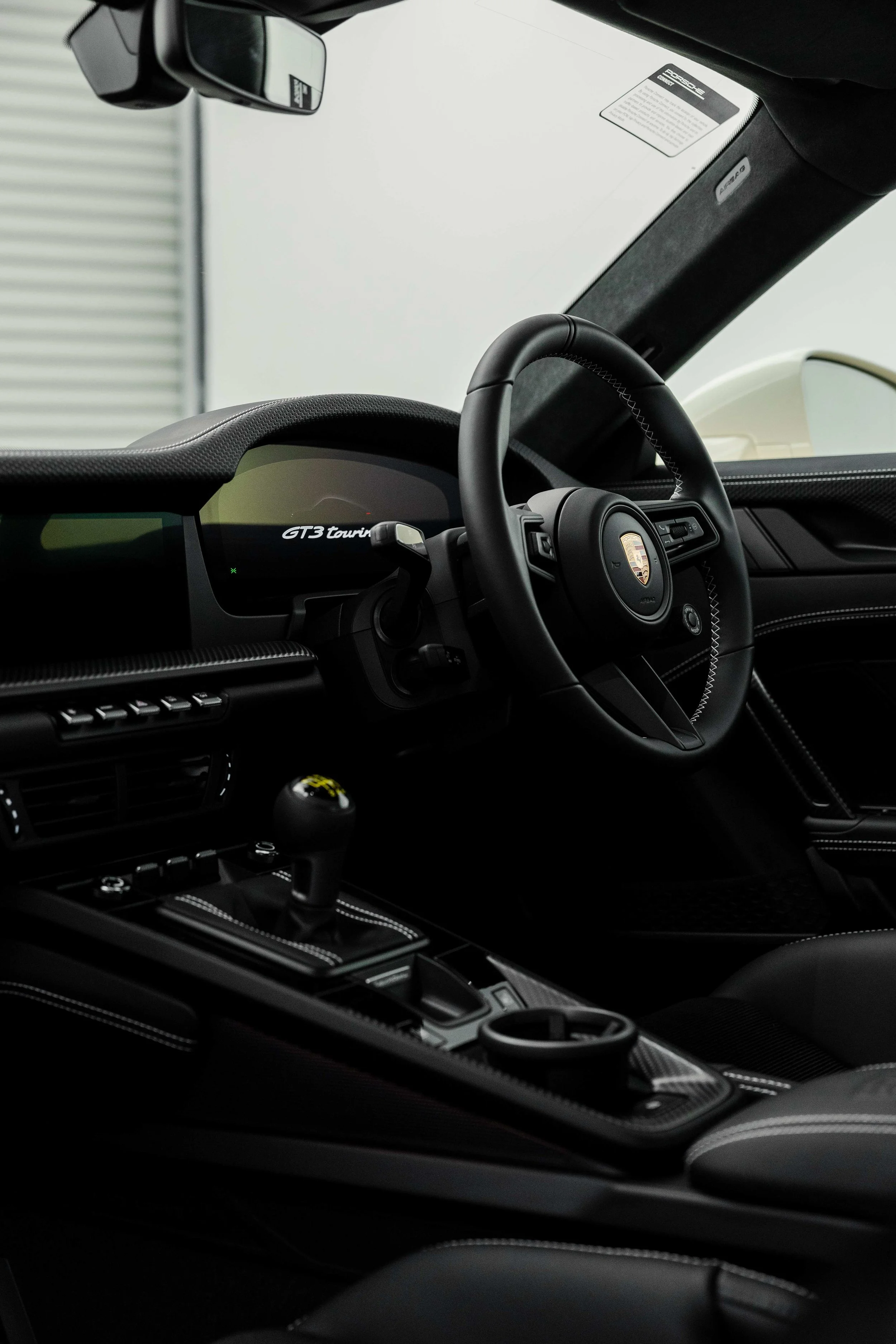 Cream Porsche 911 GT3 Touring interior detailing steering wheel and GT3 touring dash display in Sydney