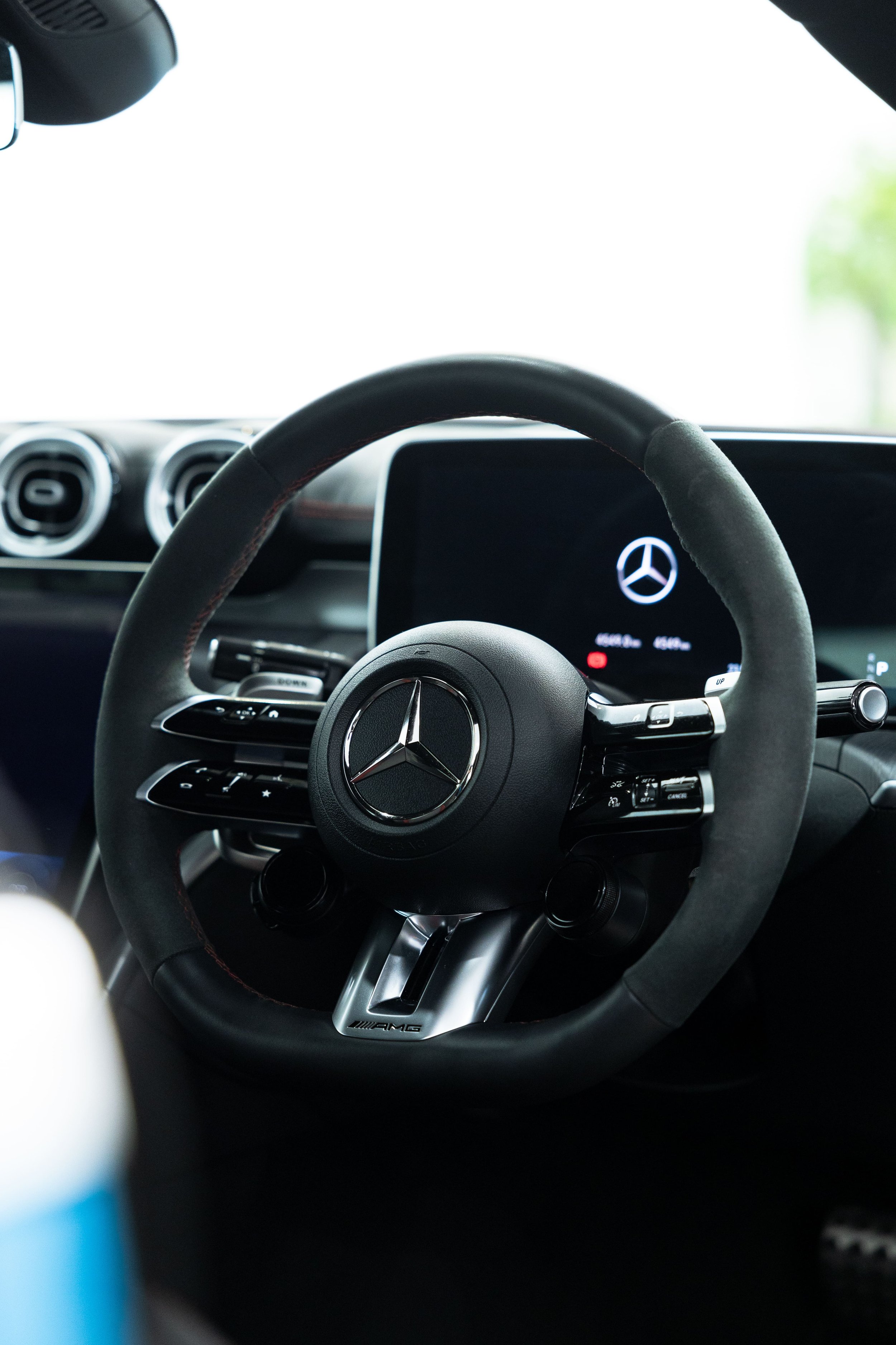 Mercedes-AMG steering wheel and digital cockpit interior in custom blue wrapped vehicle by ADS in Mona Vale