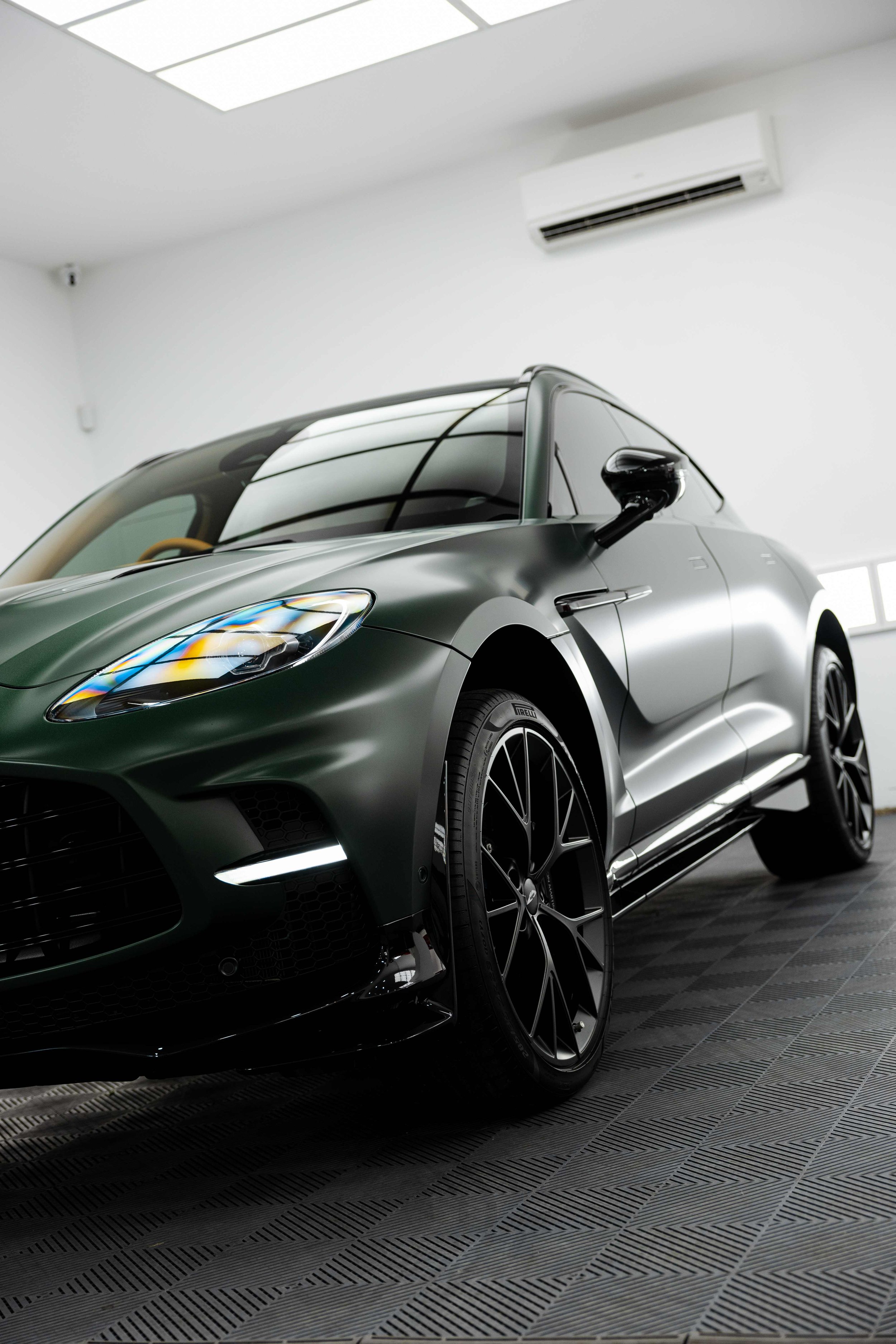 Matte green Aston Martin DBX front quarter and wheel with XPEL Stealth Paint Protection Film in Sydney