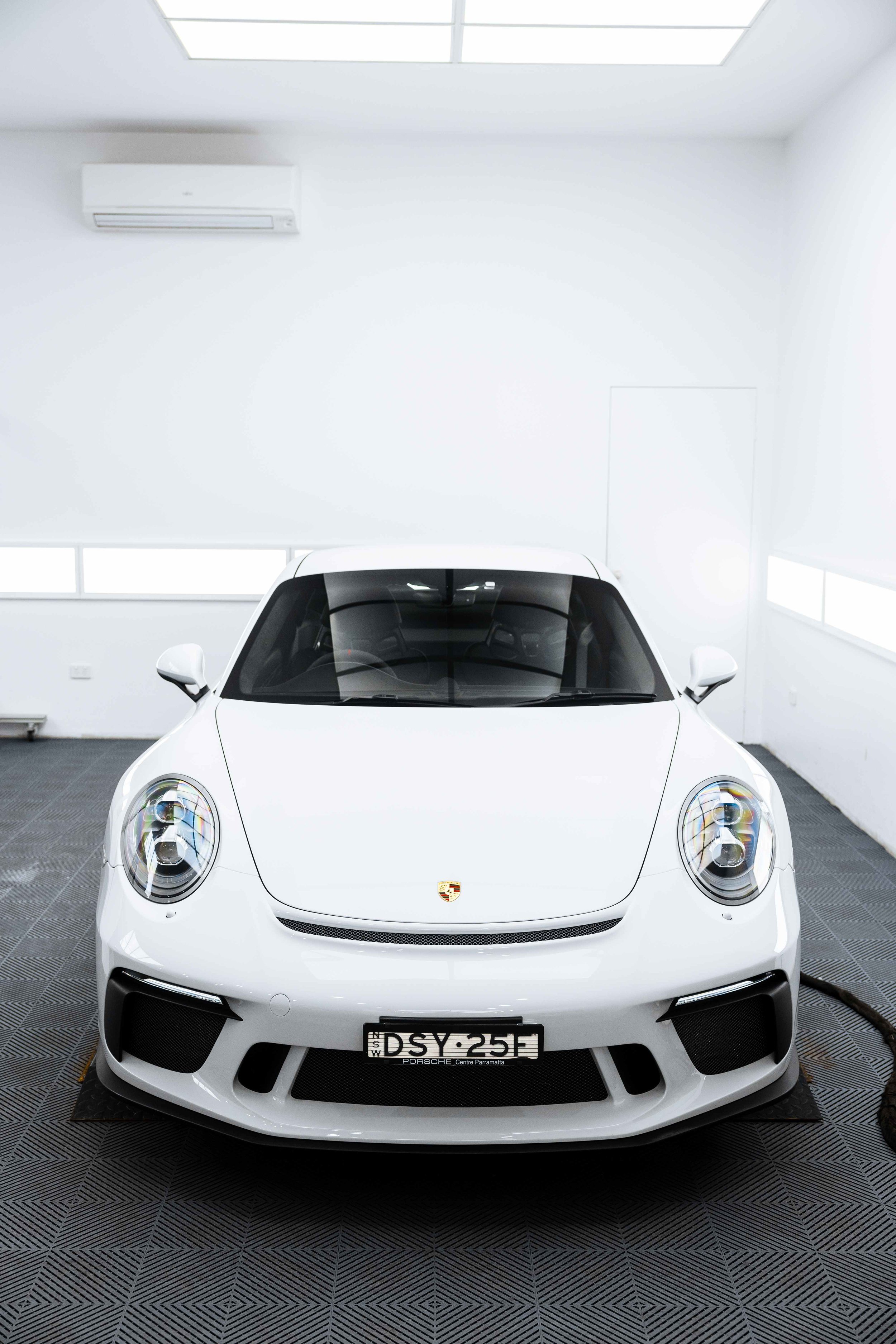 White Porsche GT3 front view in studio with XPEL Paint Protection Film in Sydney