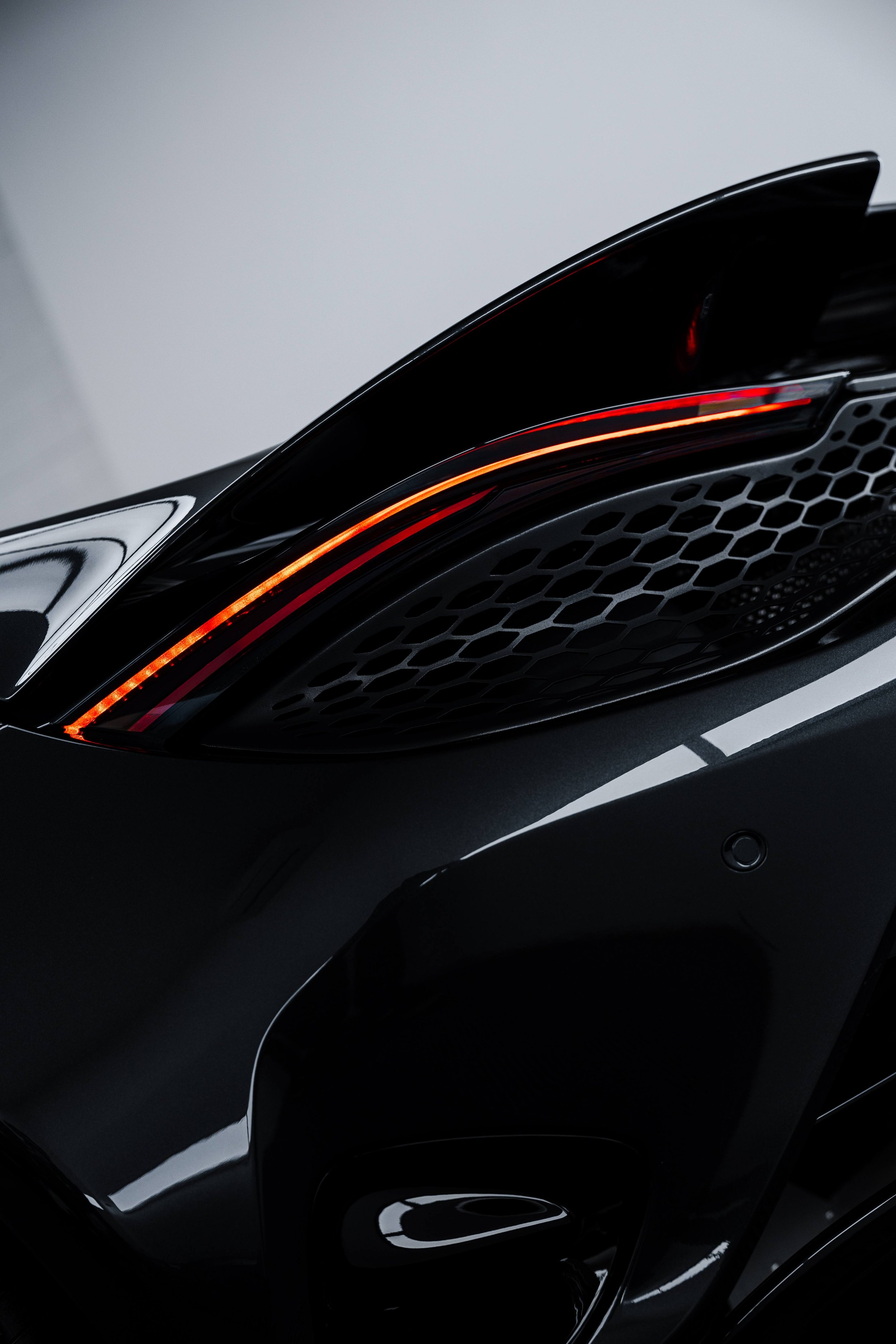 Black McLaren 750S taillight and rear vent detail with XPEL Paint Protection Film in Mona Vale