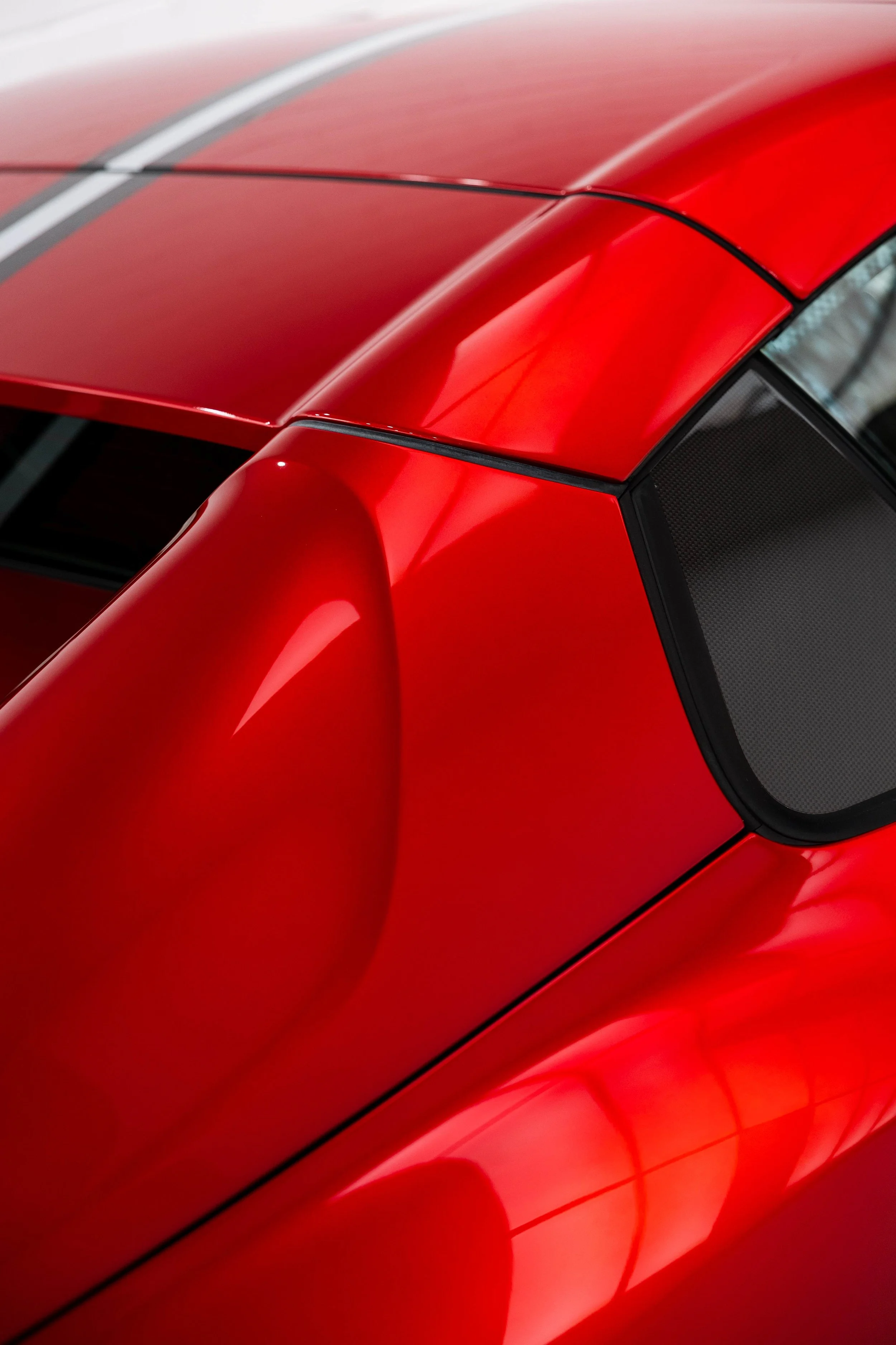 Red Ferrari 812 GTS roofline and rear quarter window with XPEL Paint Protection Film in Mona Vale