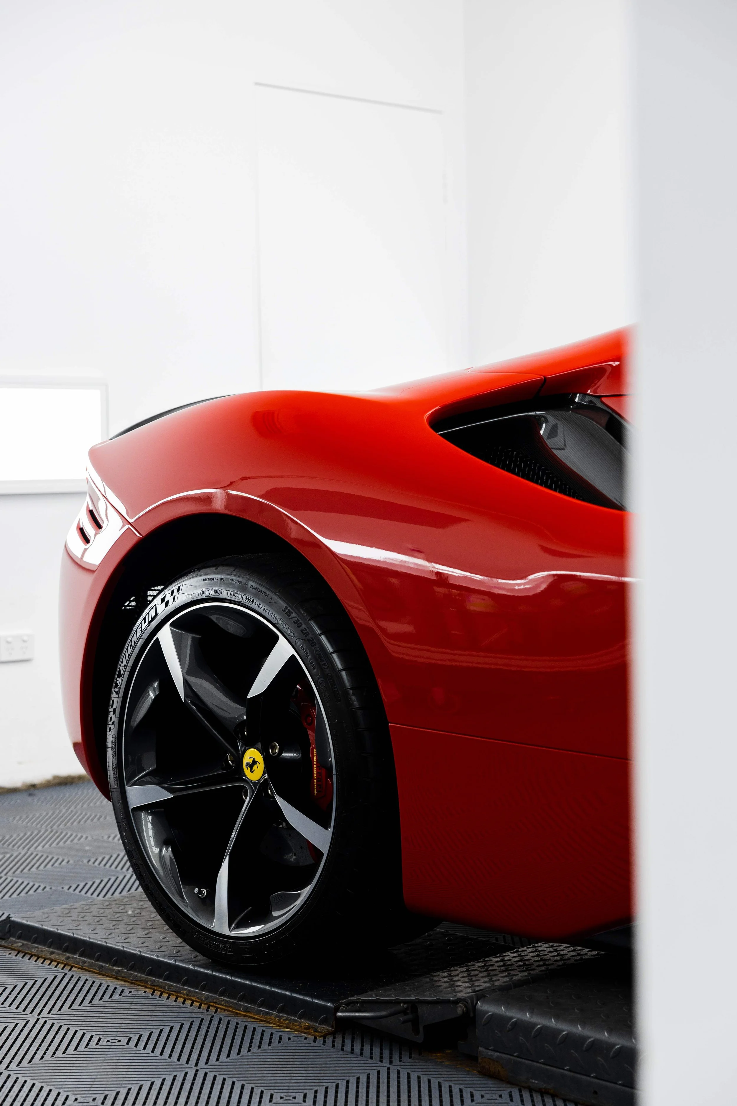 Red Ferrari SF90 Spyder rear guard and wheel with XPEL Paint Protection Film in Sydney