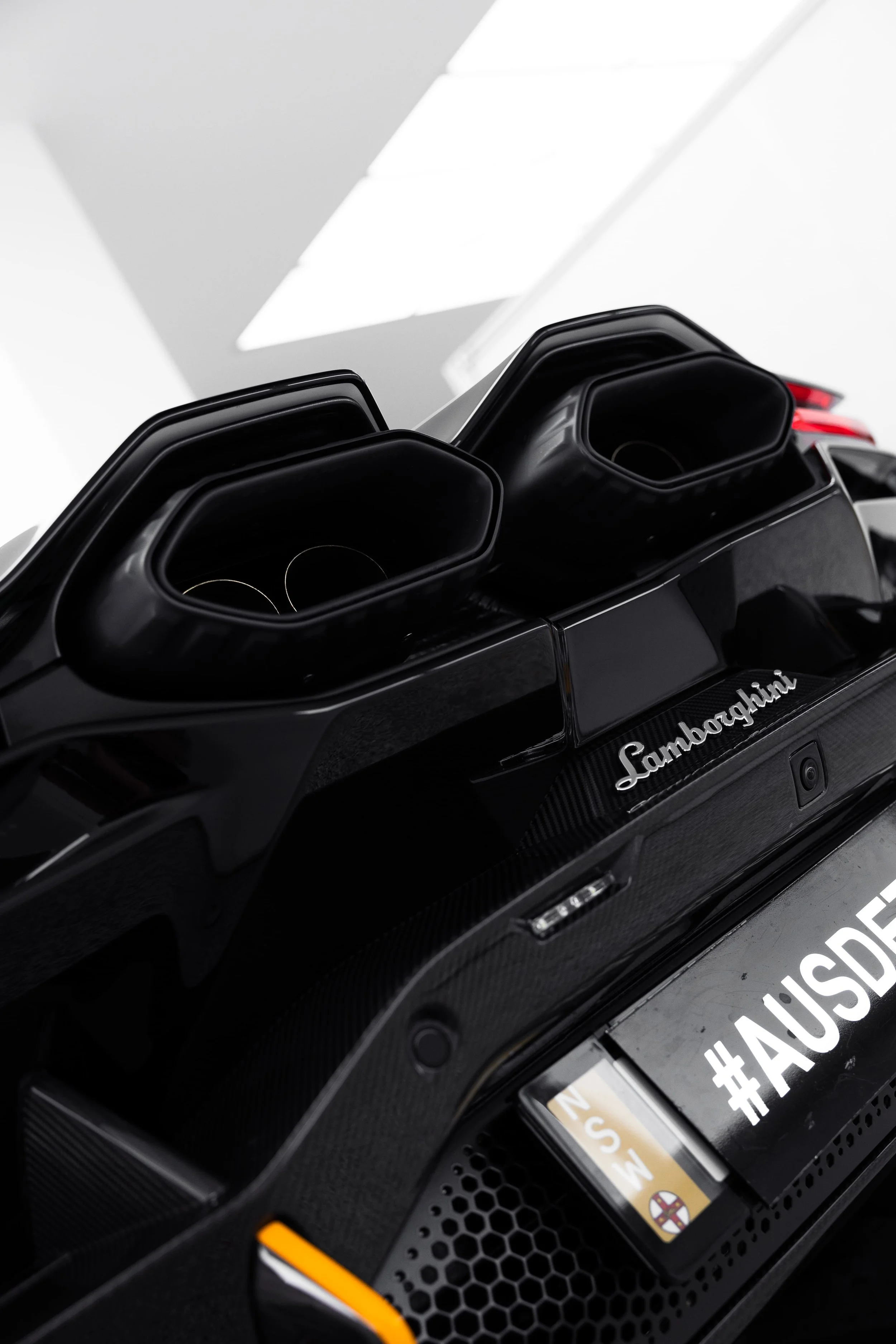 Rear exhaust detail of Lamborghini Revuelto with paint protection film and detailing by ADS in Sydney