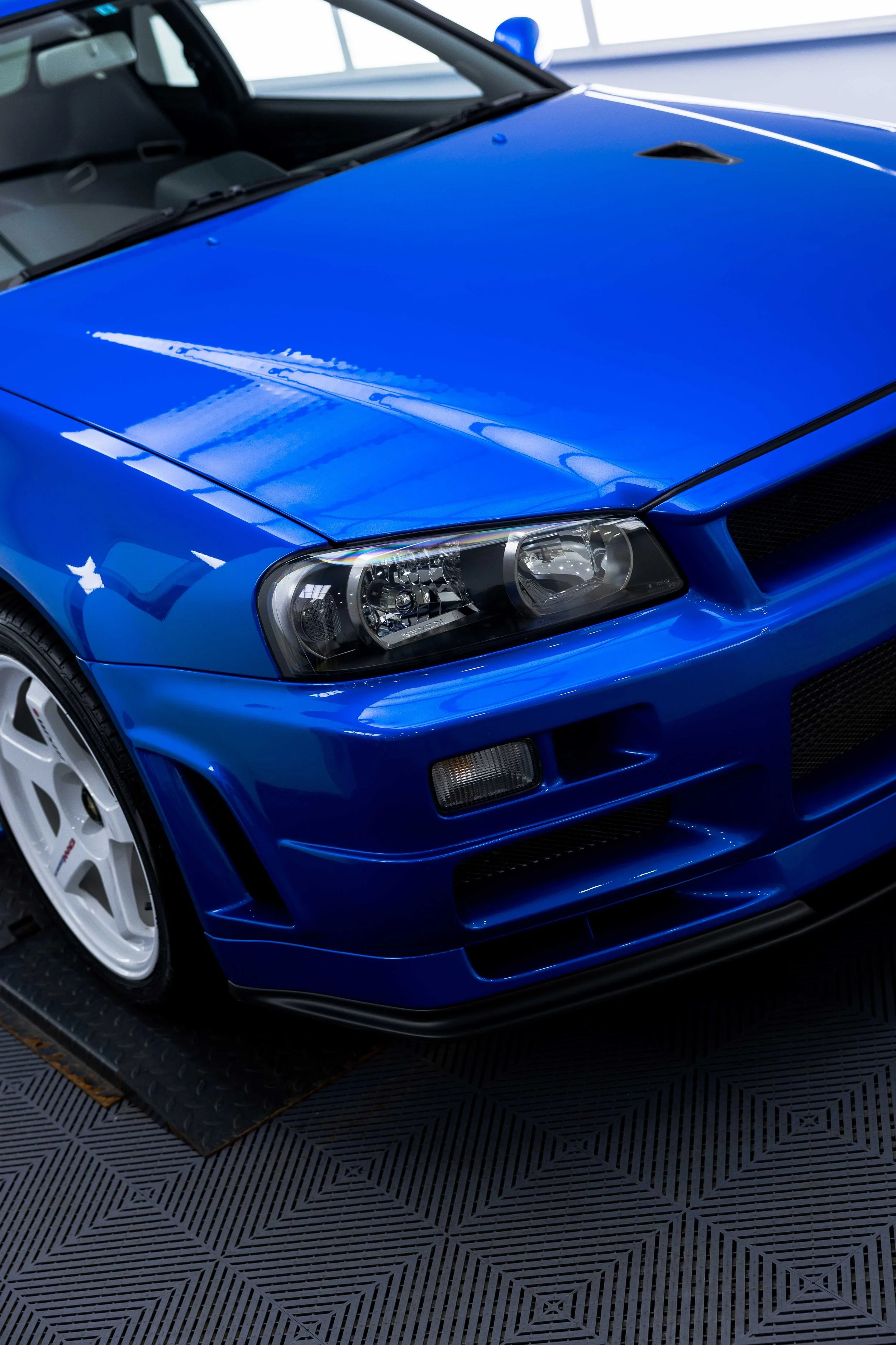 Bayside blue Nissan R34 GT-R Nur front end with XPEL Paint Protection Film in Mona Vale
