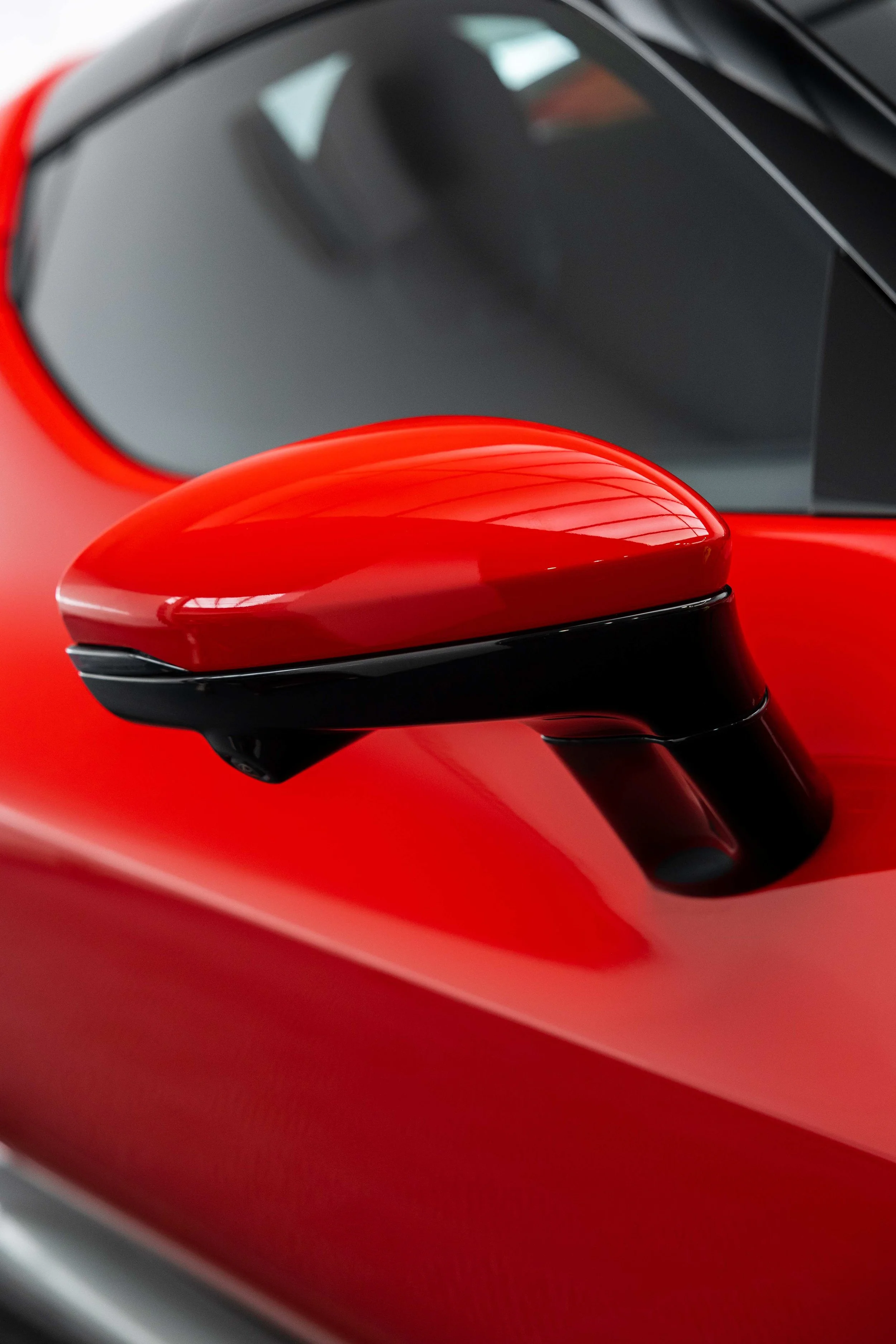Red Ferrari 296 GTS door mirror and roofline with XPEL Paint Protection Film in Sydney
