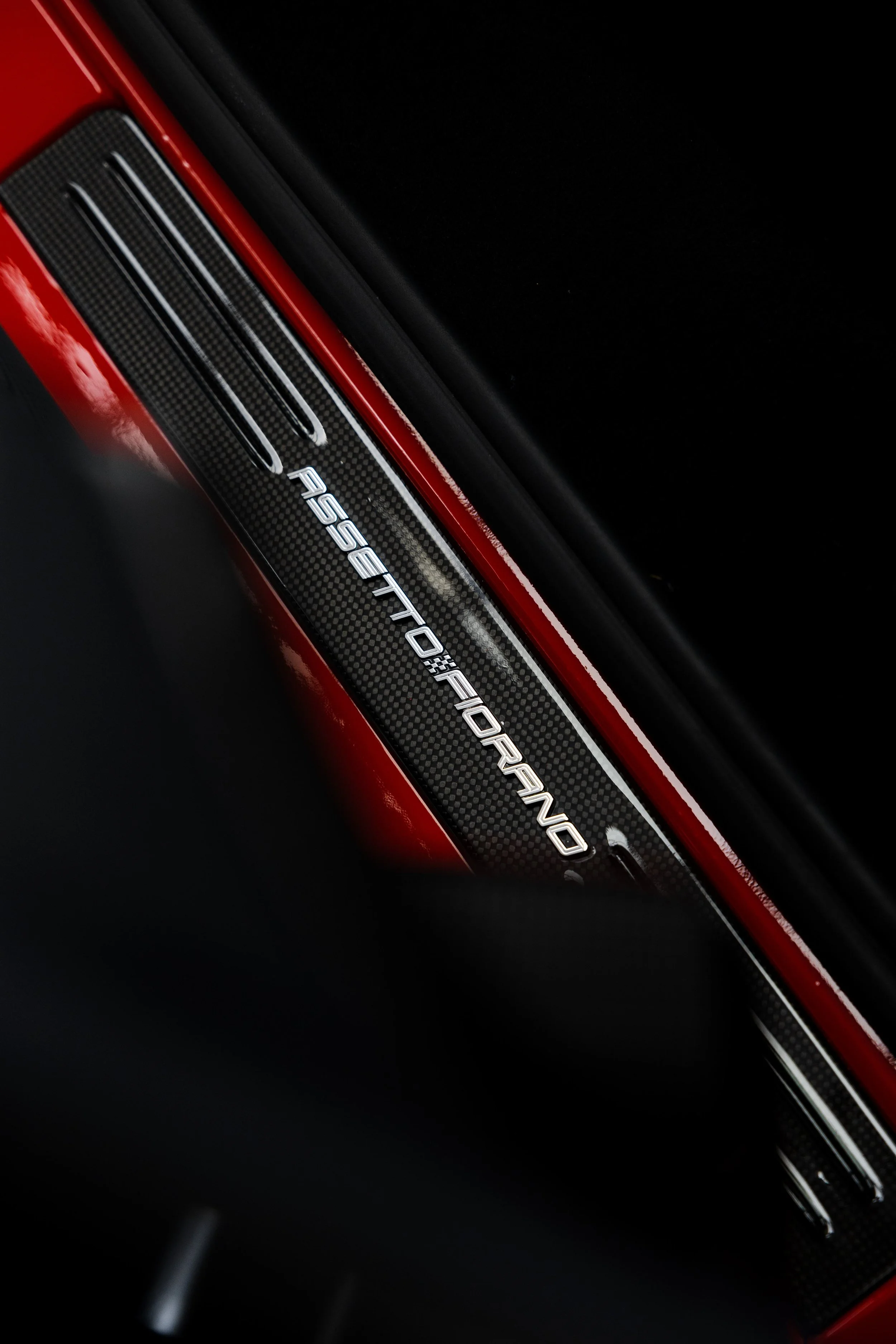 Red Ferrari SF90 Spyder interior detailing Assetto Fiorano carbon door sill in Sydney