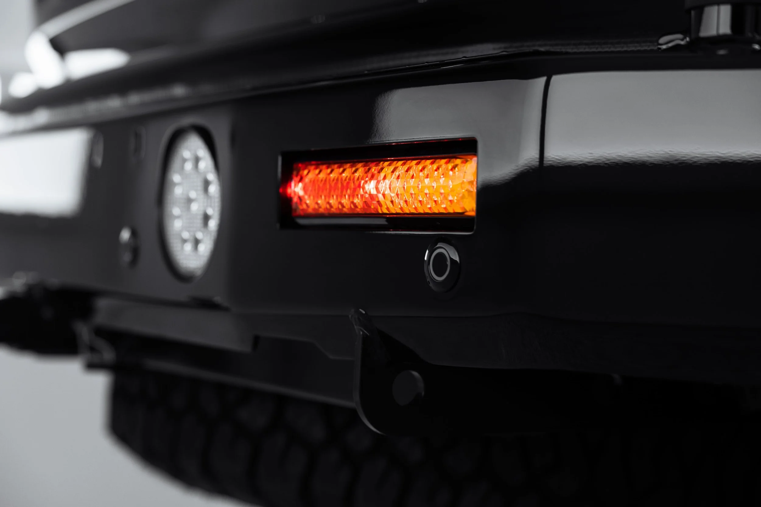 Close-up of Y62 Nissan Patrol rear bumper reflector and sensor with detailed finish by ADS in Sydney