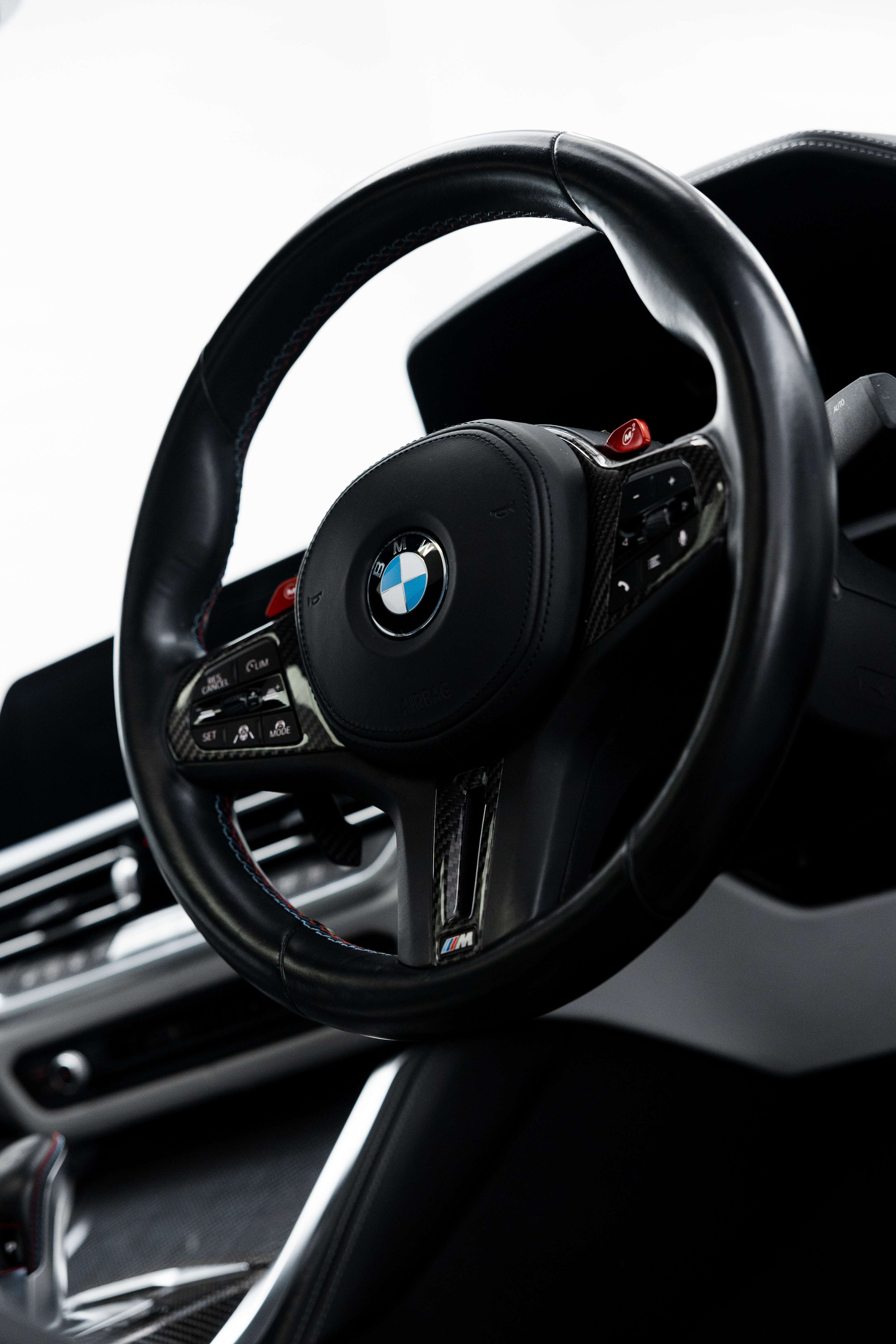 BMW M4 Competition steering wheel after interior detailing in Mona Vale