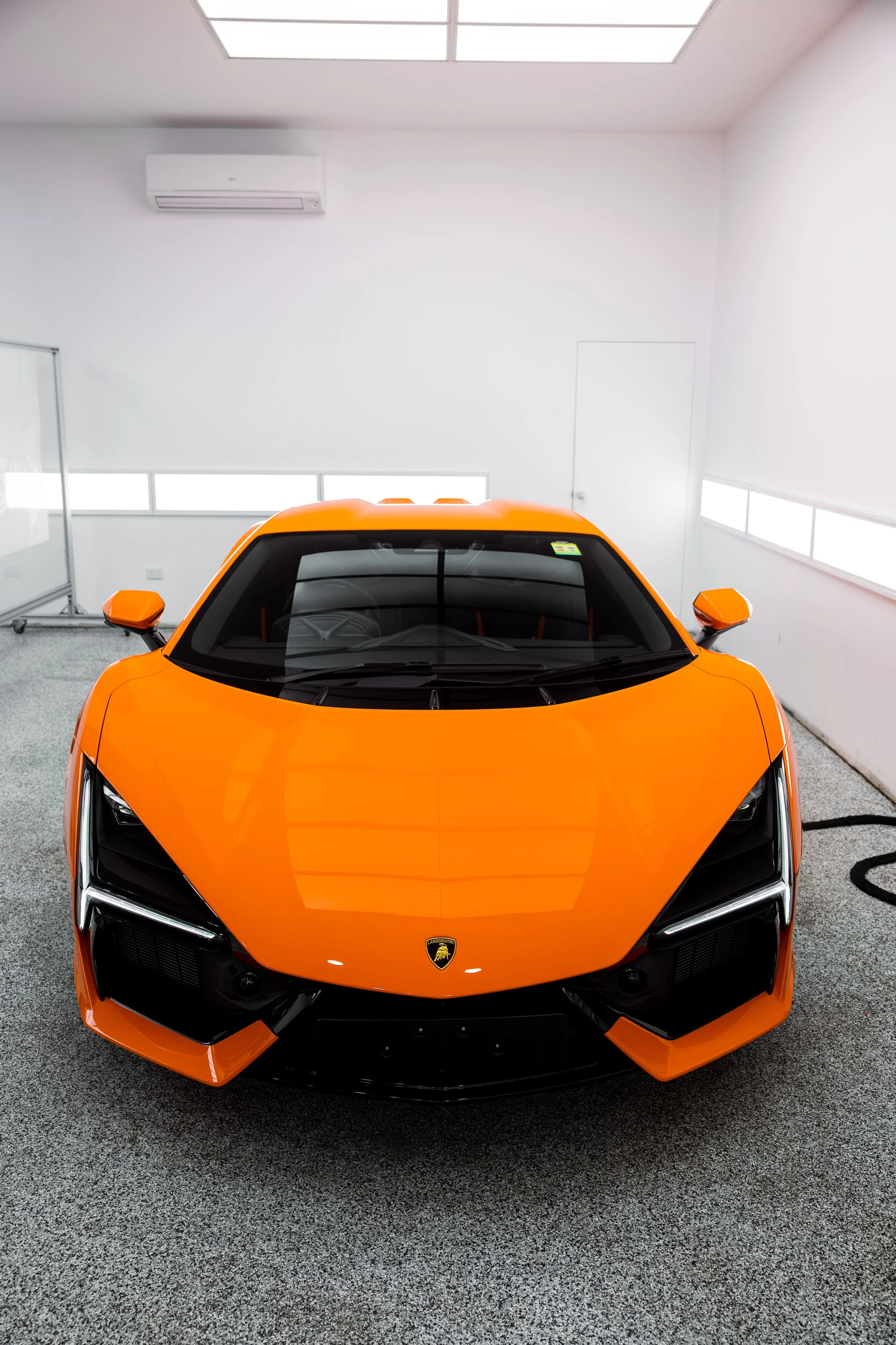 Orange Lamborghini Revuelto front view with full PPF by ADS in Mona Vale