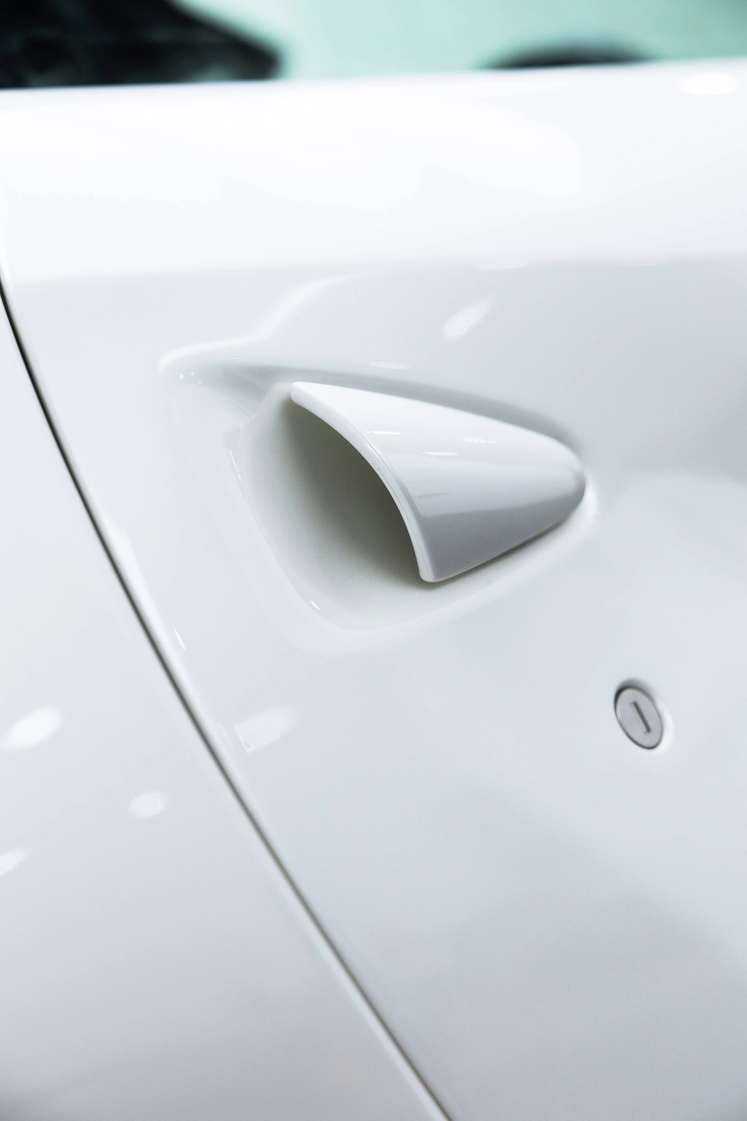 White Ferrari 812 GTS front splitter air vent detail with XPEL Paint Protection Film in Sydney