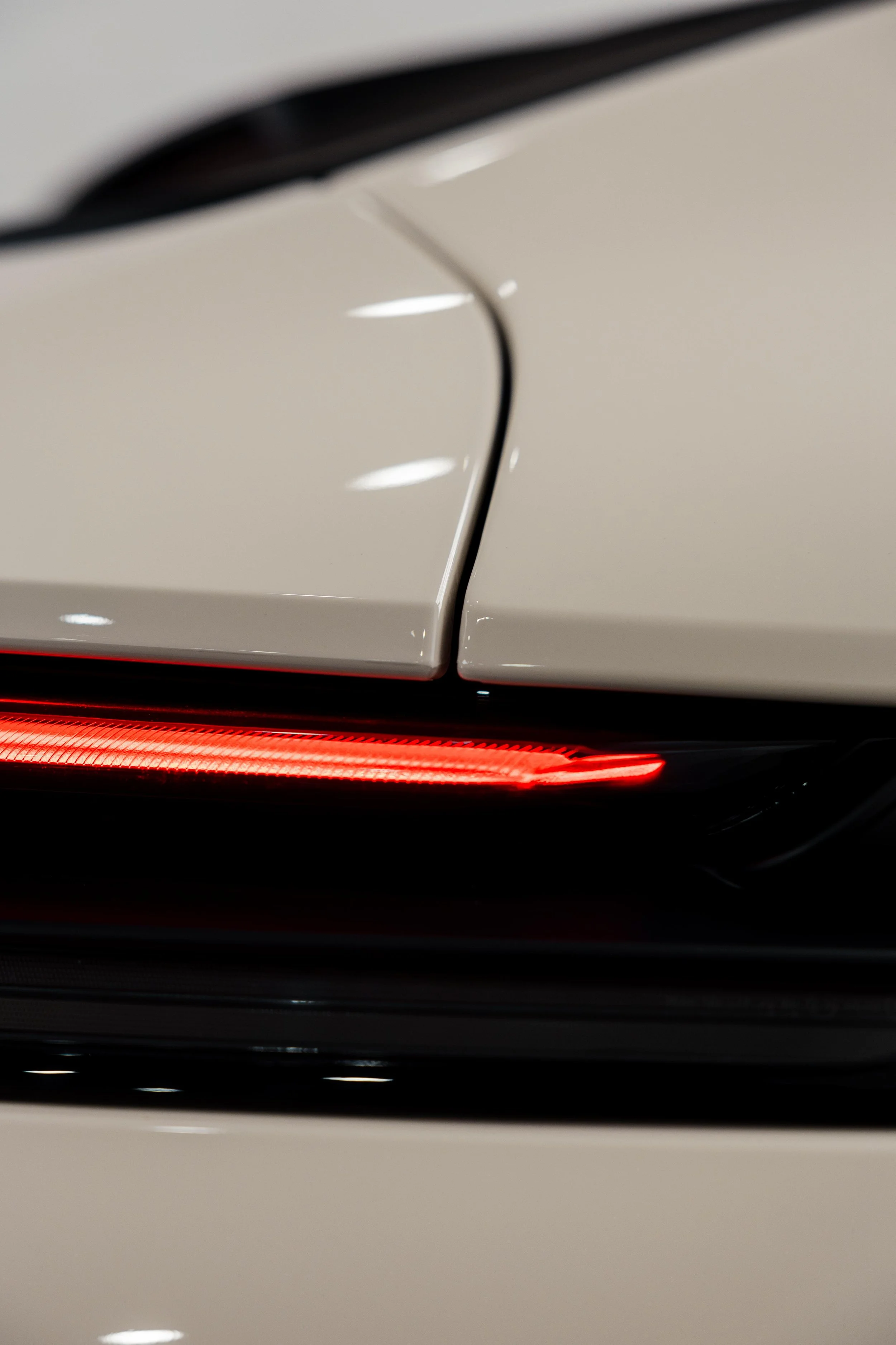 Cream Porsche 911 GT3 Touring taillight and quarter panel detail with XPEL Paint Protection Film in Sydney