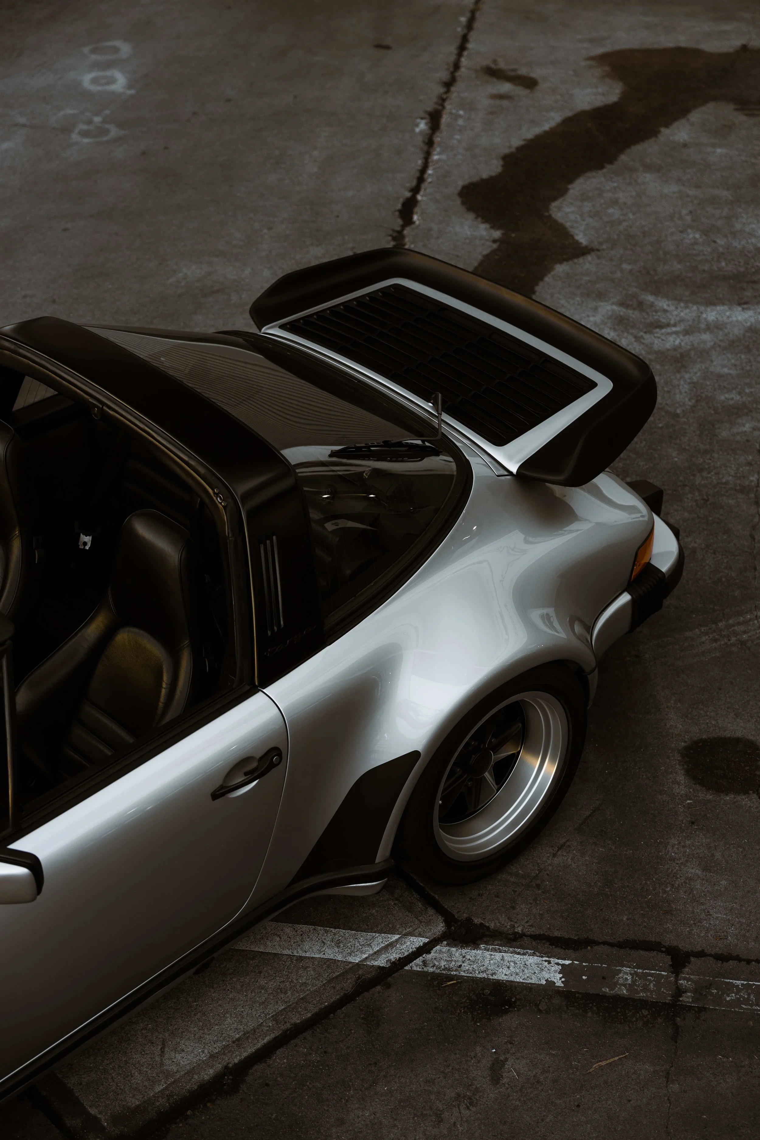 Silver 1989 Porsche 911 Carrera Targa targa top and rear quarter in Sydney
