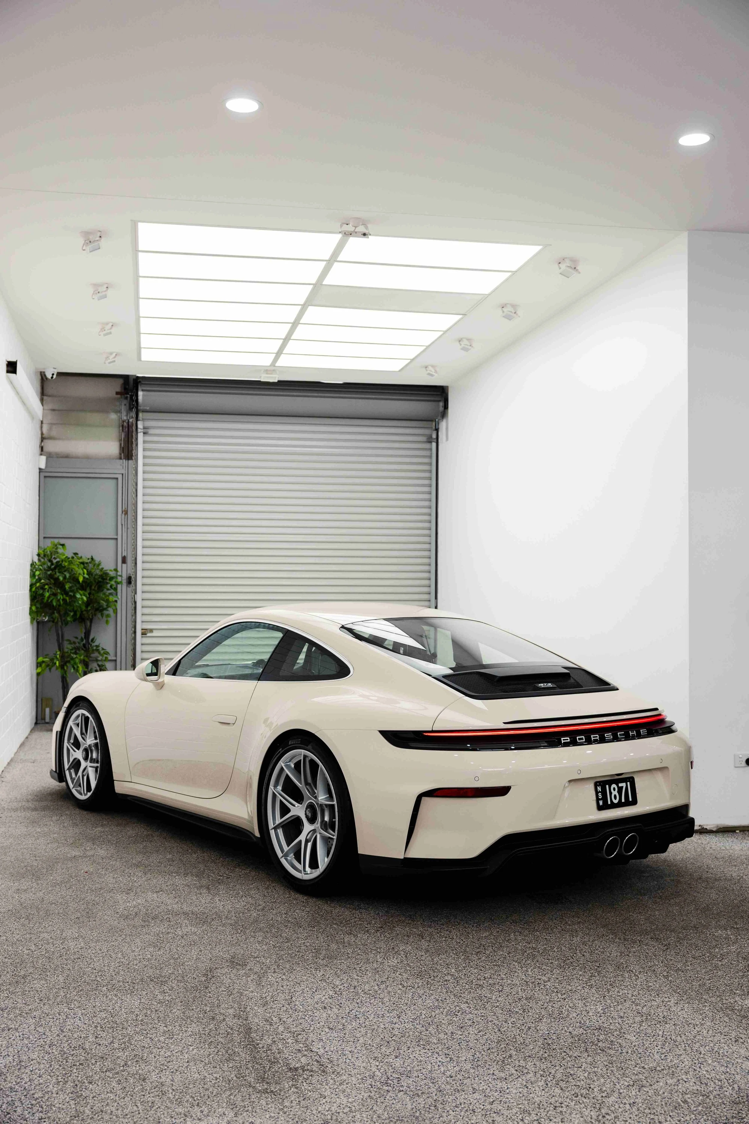 Cream Porsche 911 GT3 Touring rear three quarter in studio with XPEL Paint Protection Film in Sydney