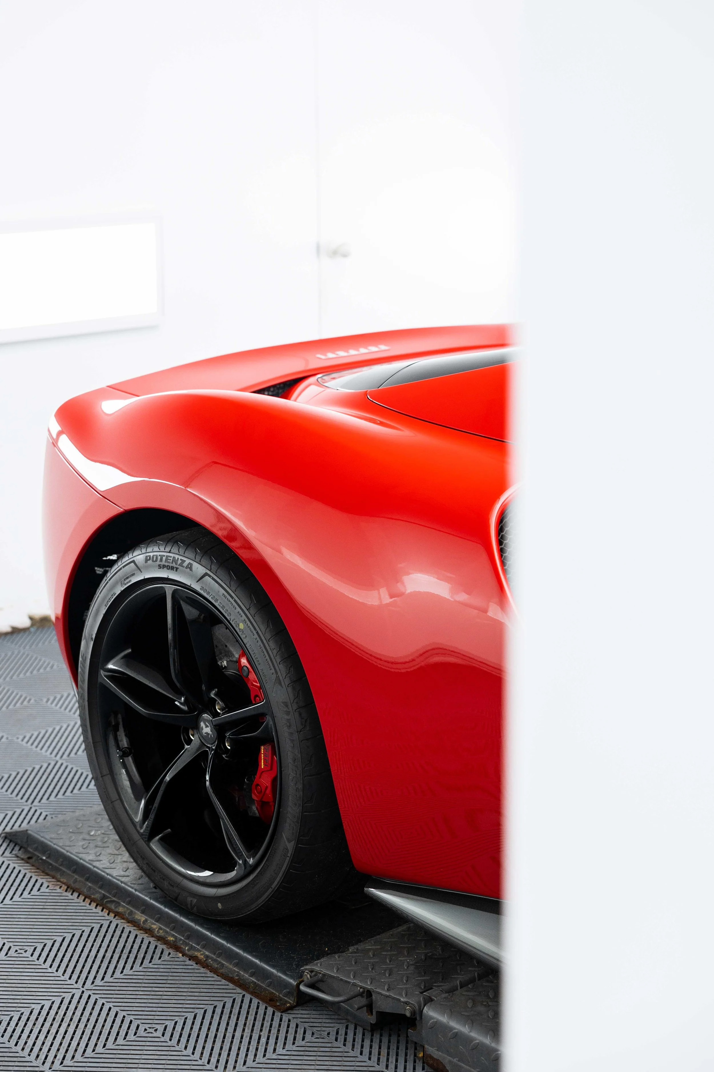 Red Ferrari 296 GTS side profile and wheel with XPEL Paint Protection Film in Mona Vale