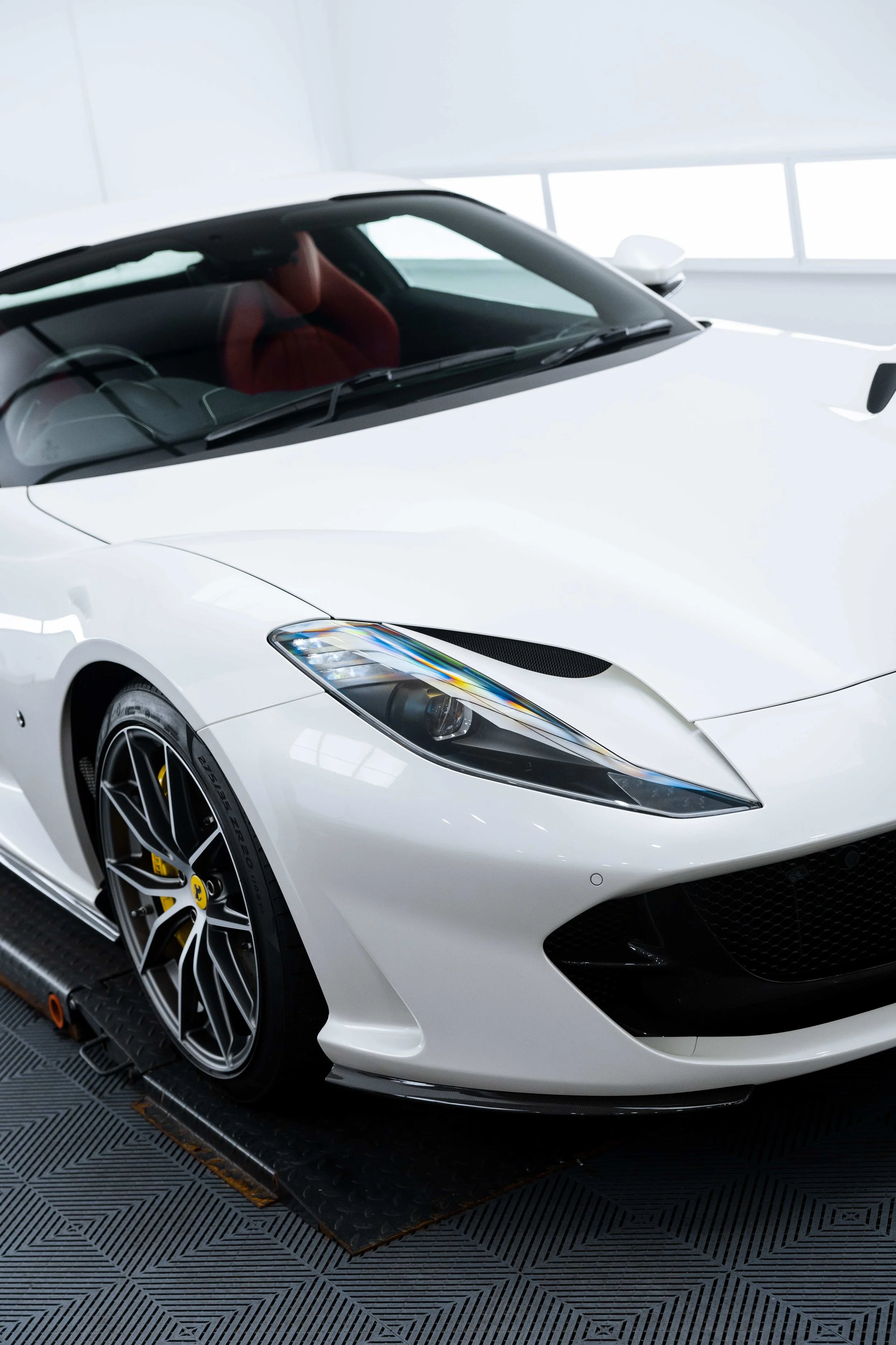 White Ferrari 812 GTS front quarter and headlight with XPEL Paint Protection Film in Mona Vale