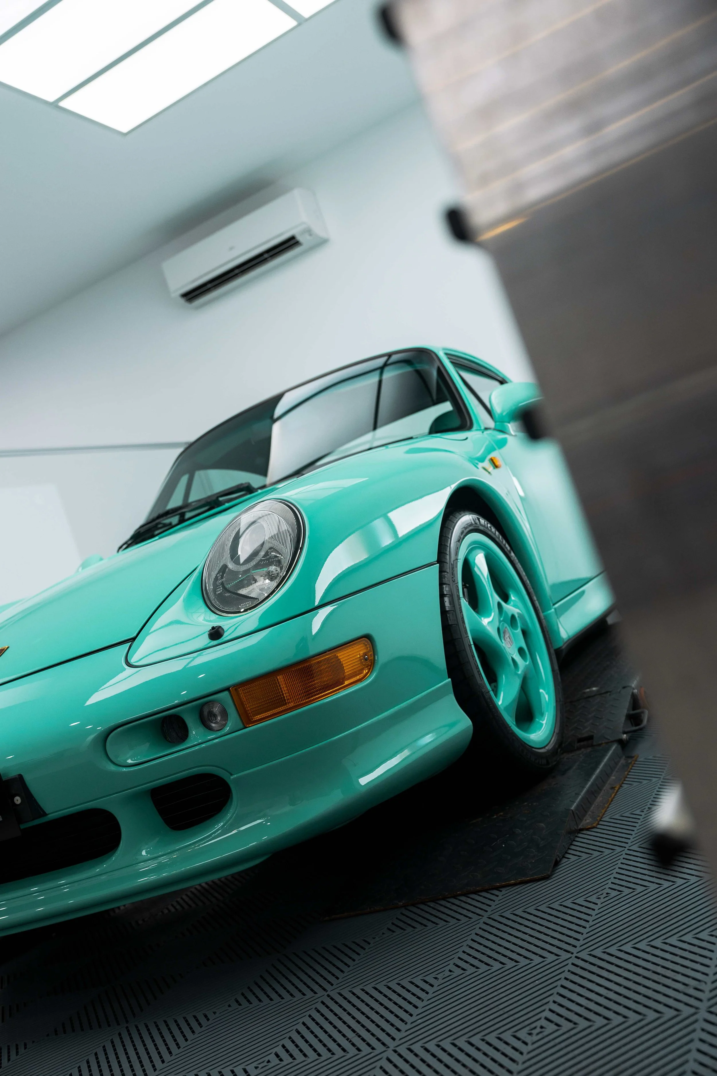 Mint green Porsche 993 front quarter and headlight with XPEL Paint Protection Film in Mona Vale