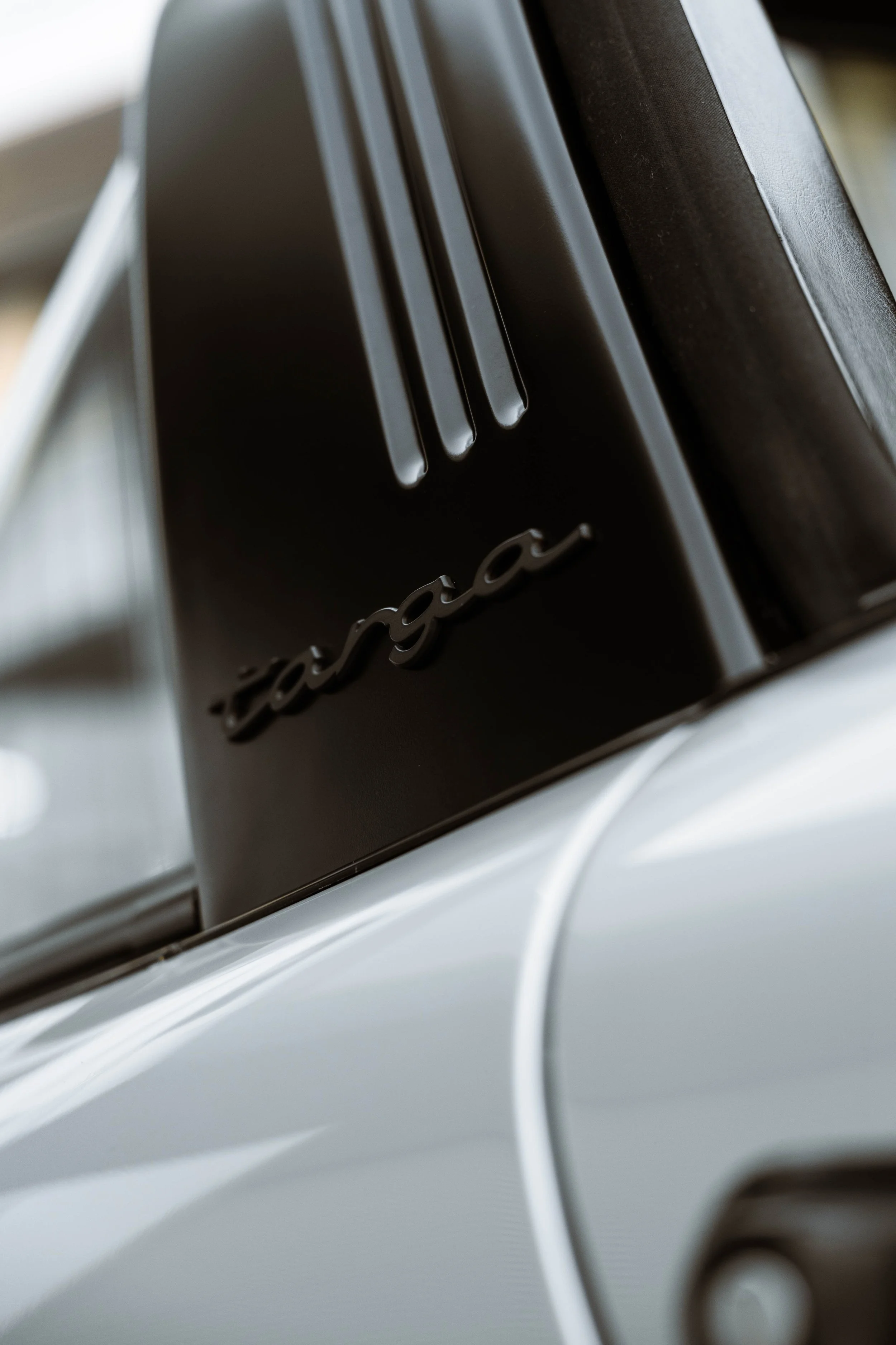 Silver 1989 Porsche 911 Carrera Targa targa script badge detail in Sydney
