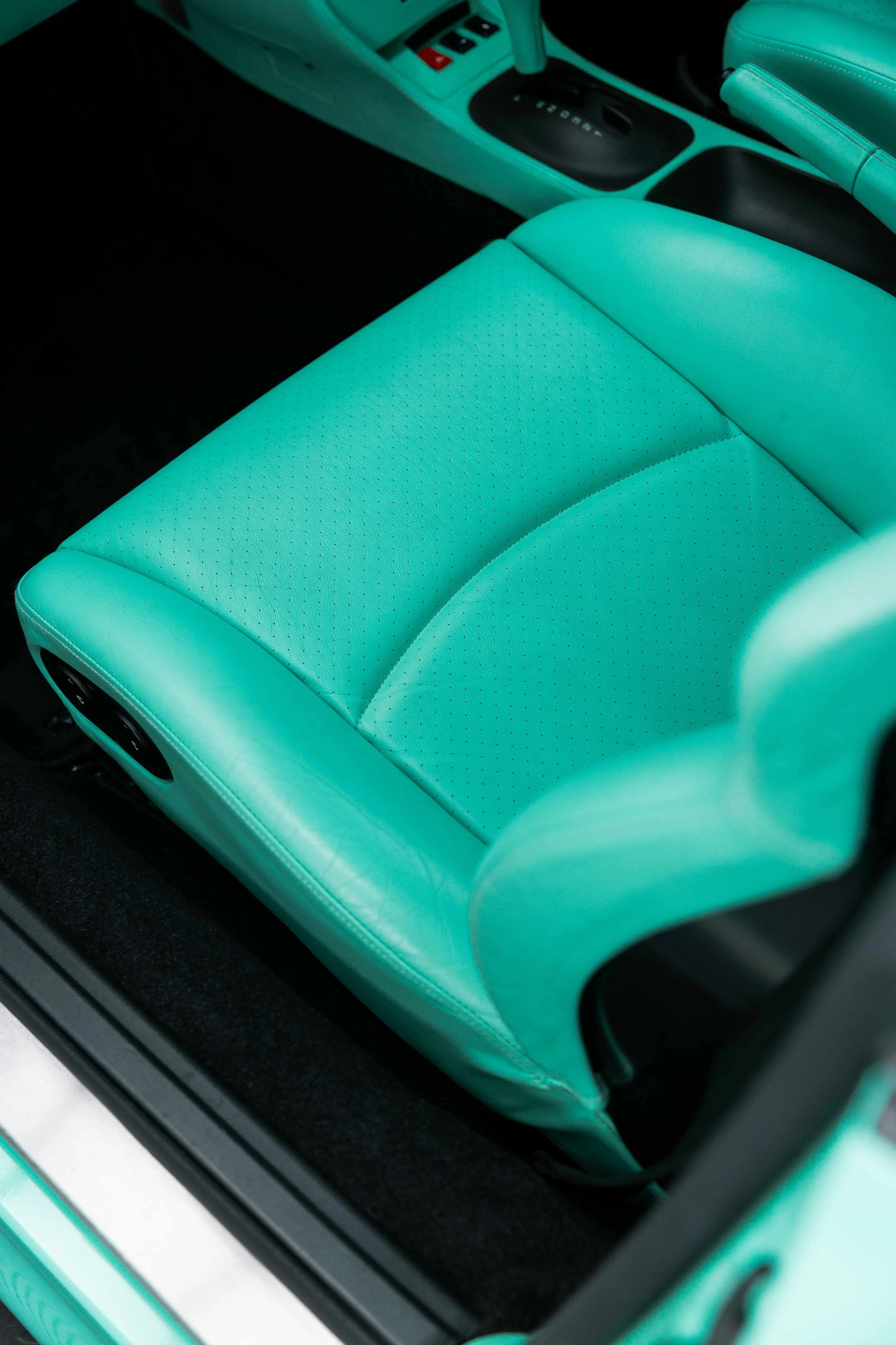 Mint green leather seat after interior detailing in Mona Vale