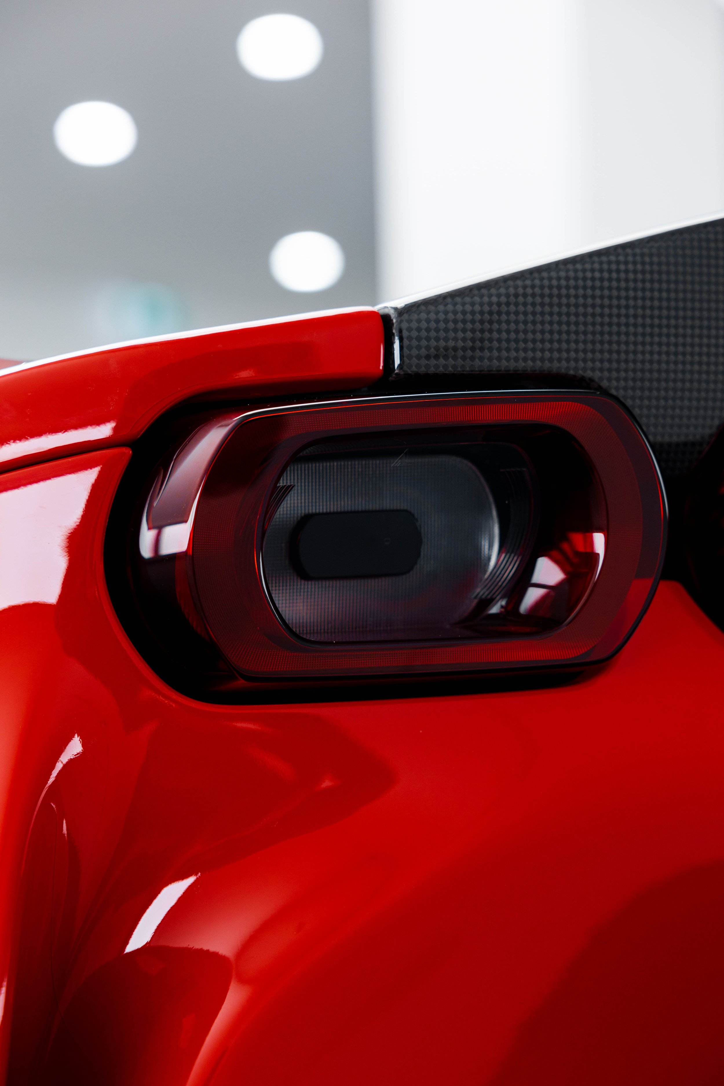 Red Ferrari SF90 Spyder taillight and rear quarter with XPEL Paint Protection Film in Sydney