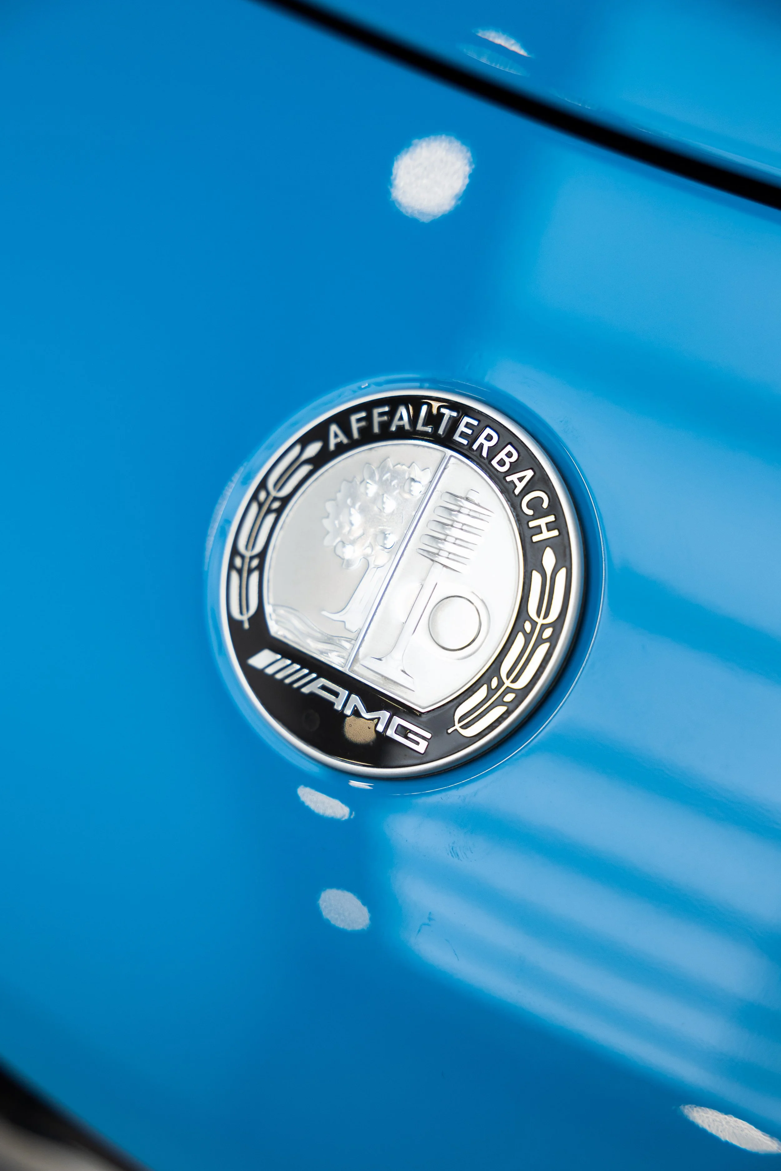 Mercedes-AMG Affalterbach badge on blue custom wrap with paint protection film by ADS in Mona Vale