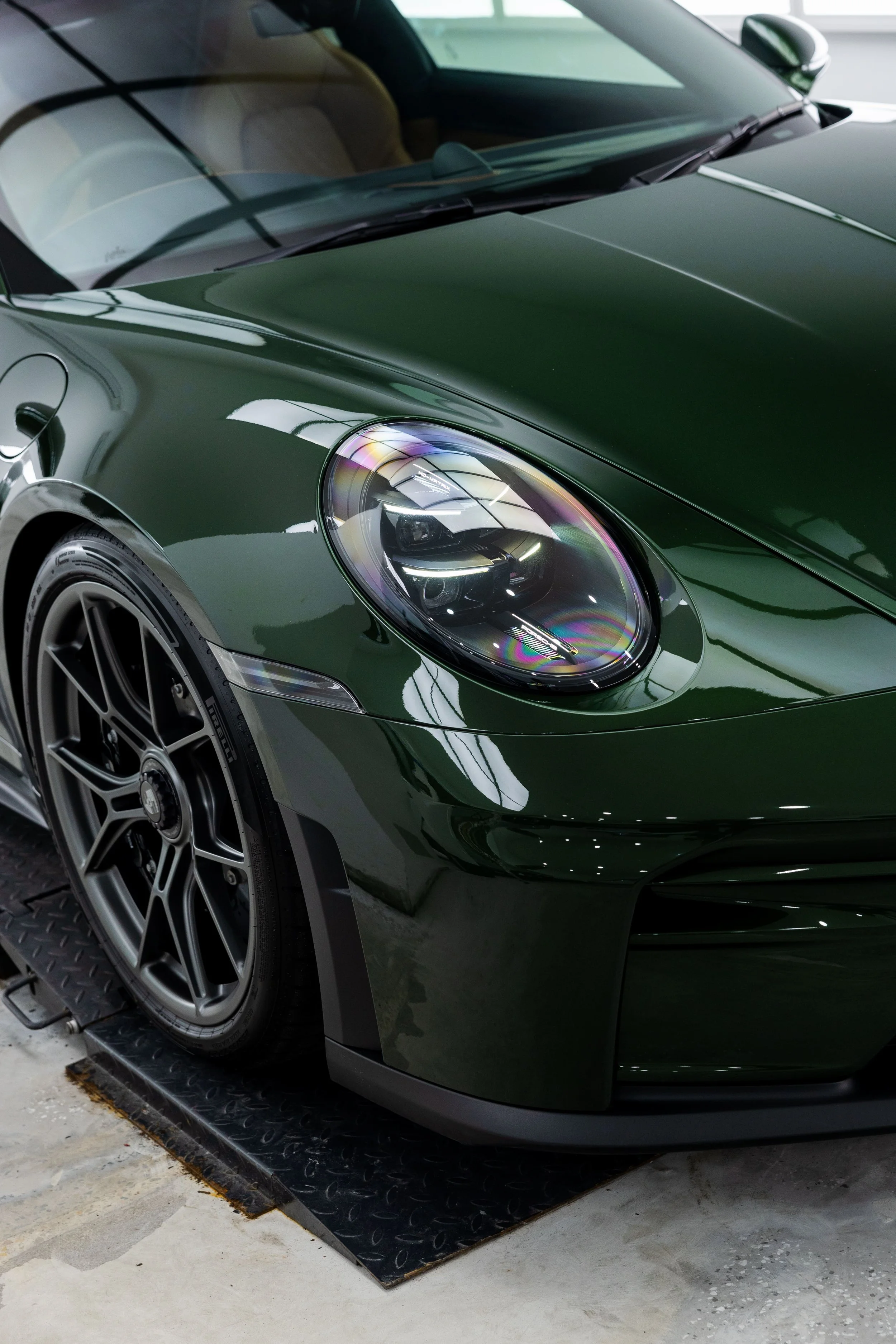 Green Porsche 911 GT3 Touring front headlight and wheel detail with full PPF by ADS in Mona Vale
