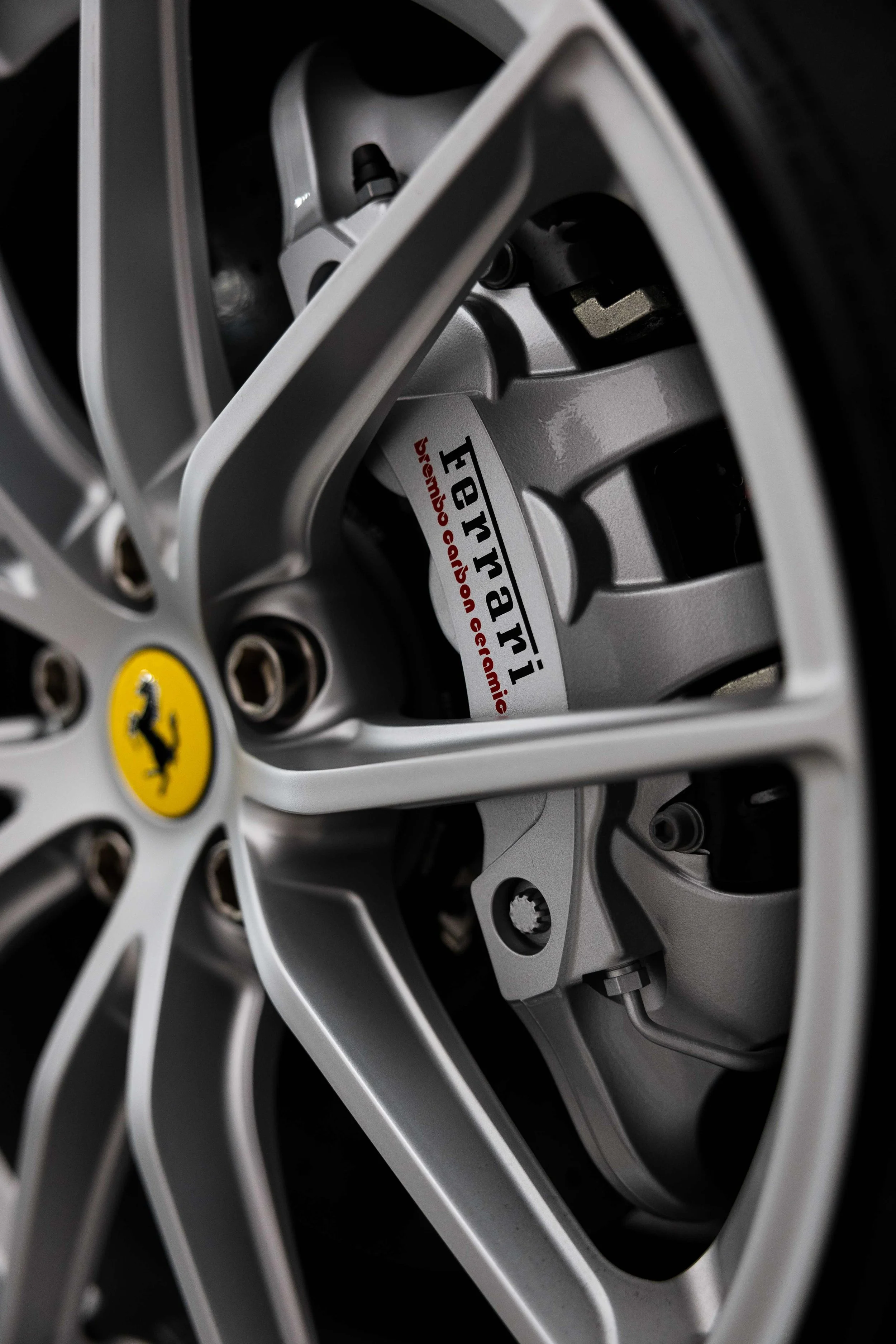 Red Ferrari 812 GTS wheel centre cap and Ferrari brake caliper with XPEL Paint Protection Film in Mona Vale