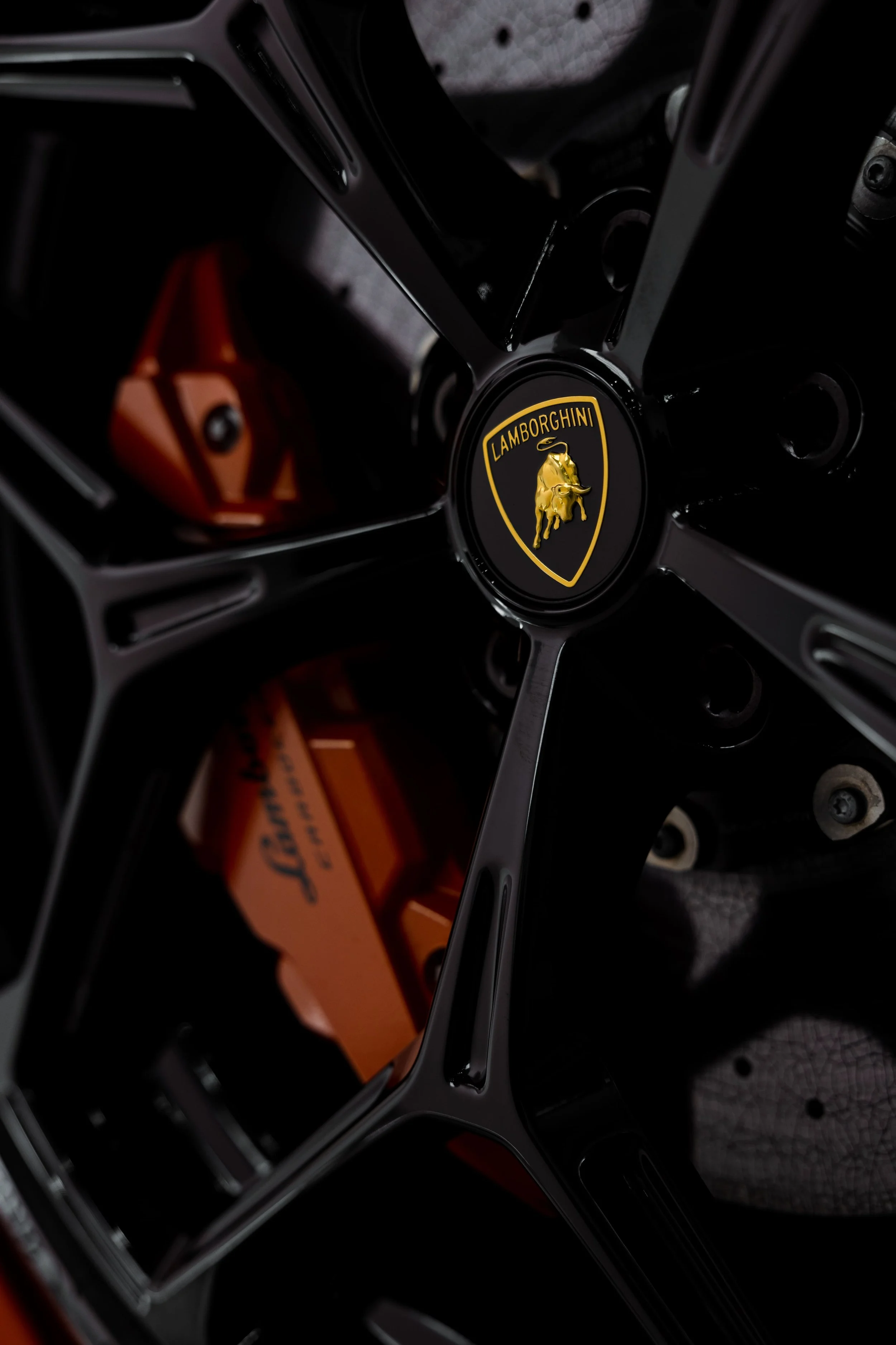 Lamborghini Revuelto wheel detail with orange brake calipers and full PPF by ADS in Mona Vale
