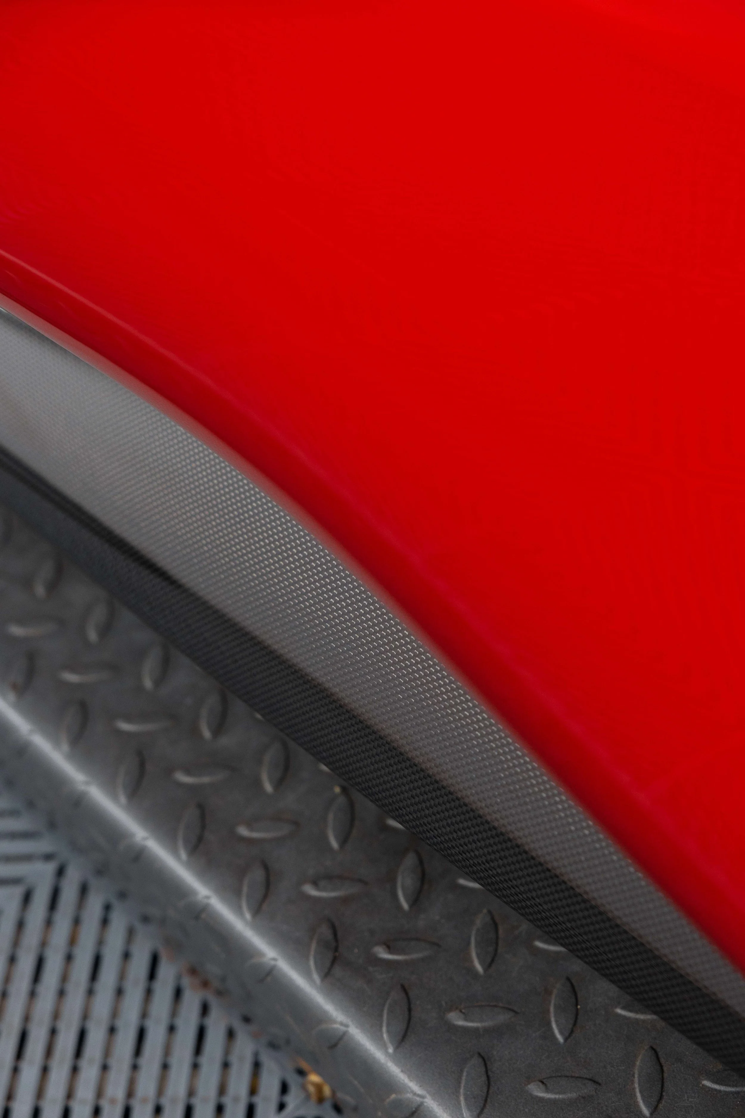 Red Ferrari 296 GTS interior detailing door sill and carbon trim in Sydney