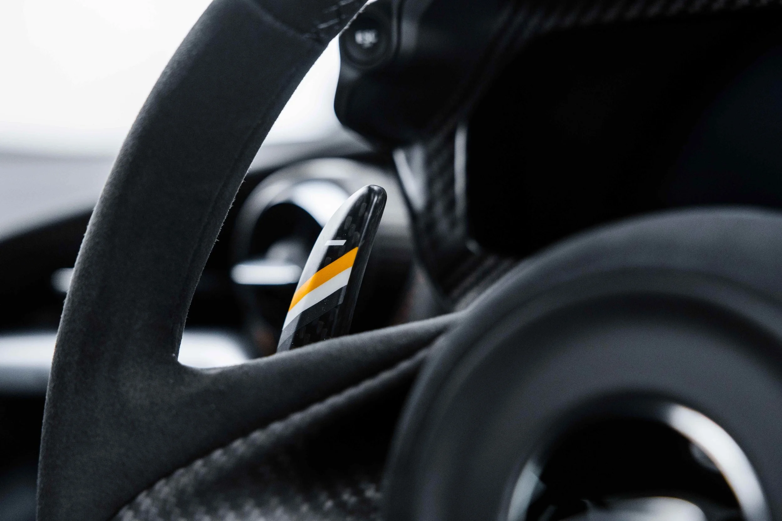 Black McLaren 750S interior detailing steering wheel paddle shift detail in Sydney