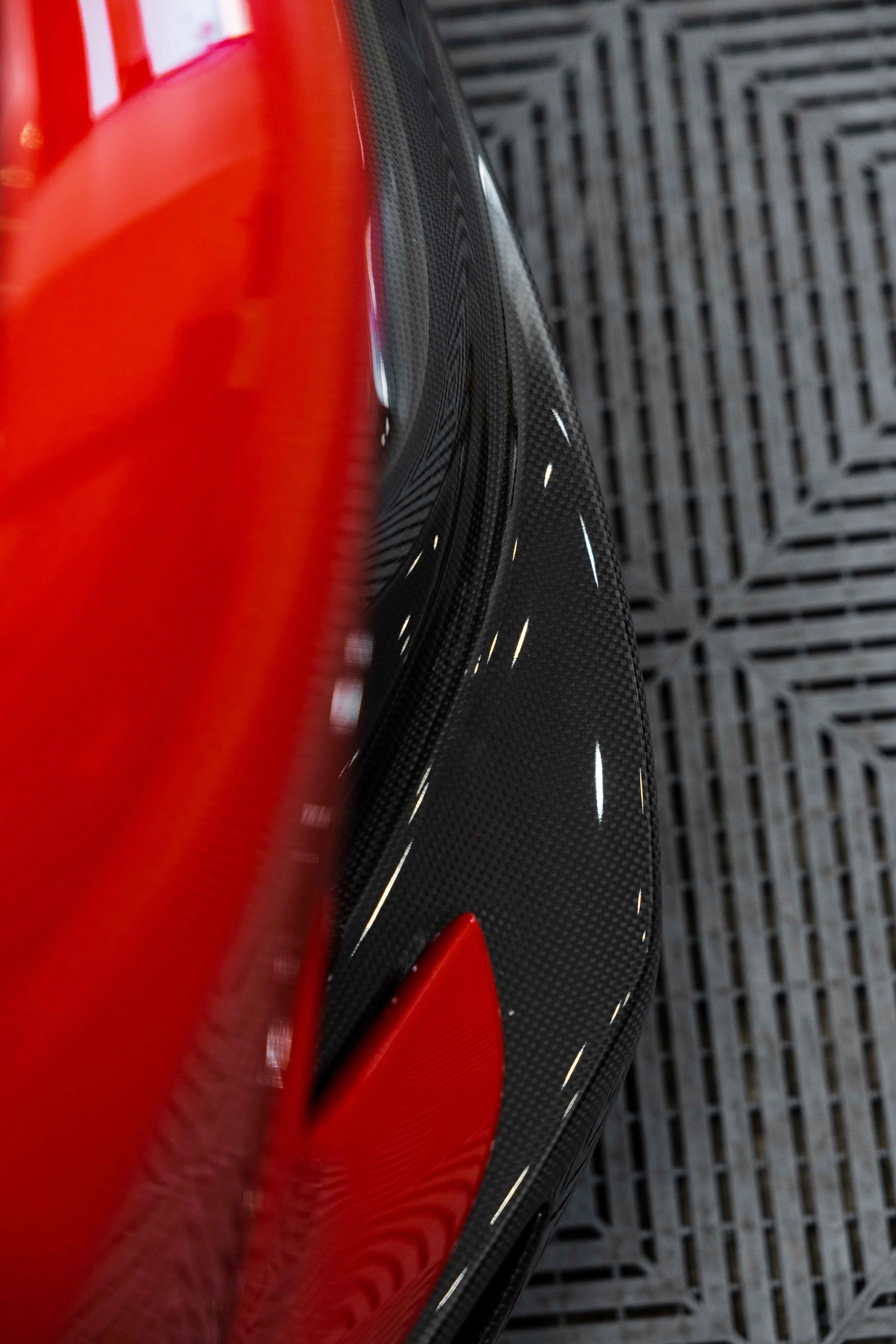 Red Ferrari 296 Speciale rear guard and carbon fibre trim detail with XPEL Paint Protection Film in Mona Vale