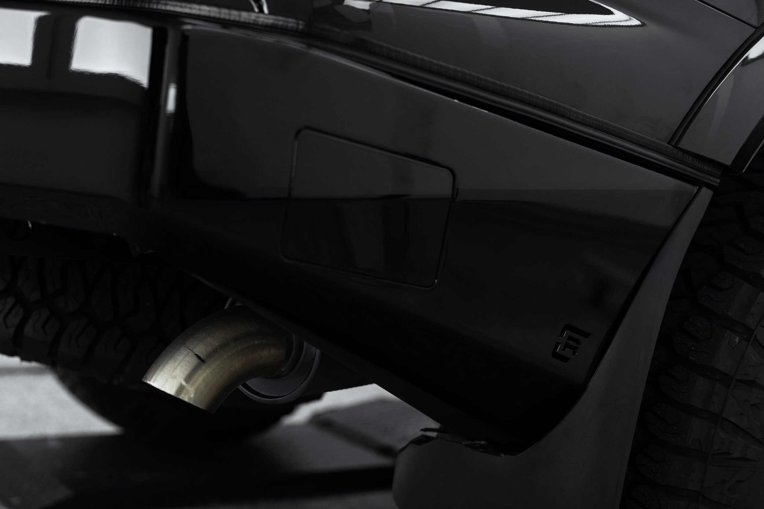 Rear underside of Y62 Nissan Patrol showing exhaust and bumper with protective detailing by ADS in Sydney