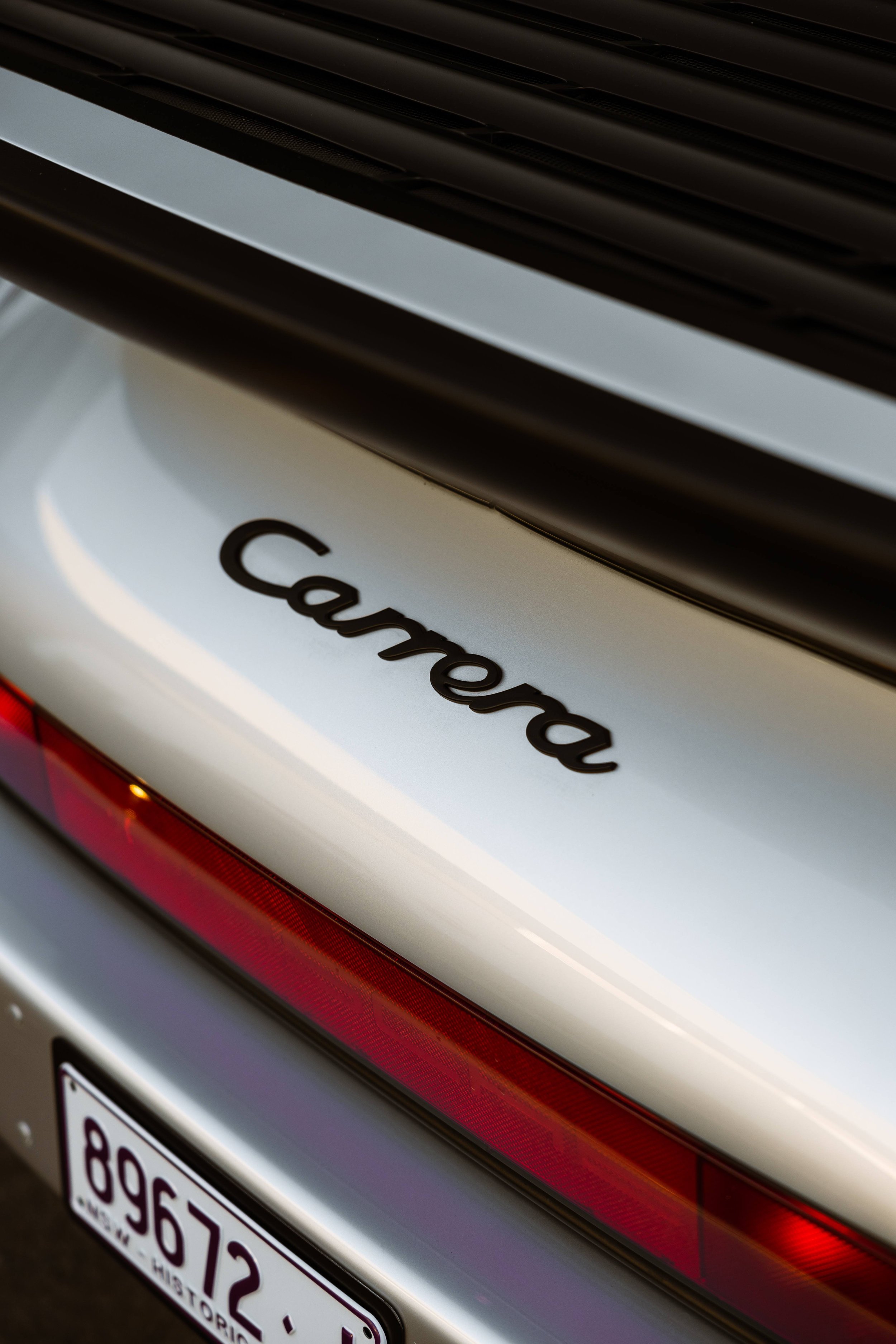 Silver 1989 Porsche 911 Carrera Targa Carrera script and taillight detail in Sydney