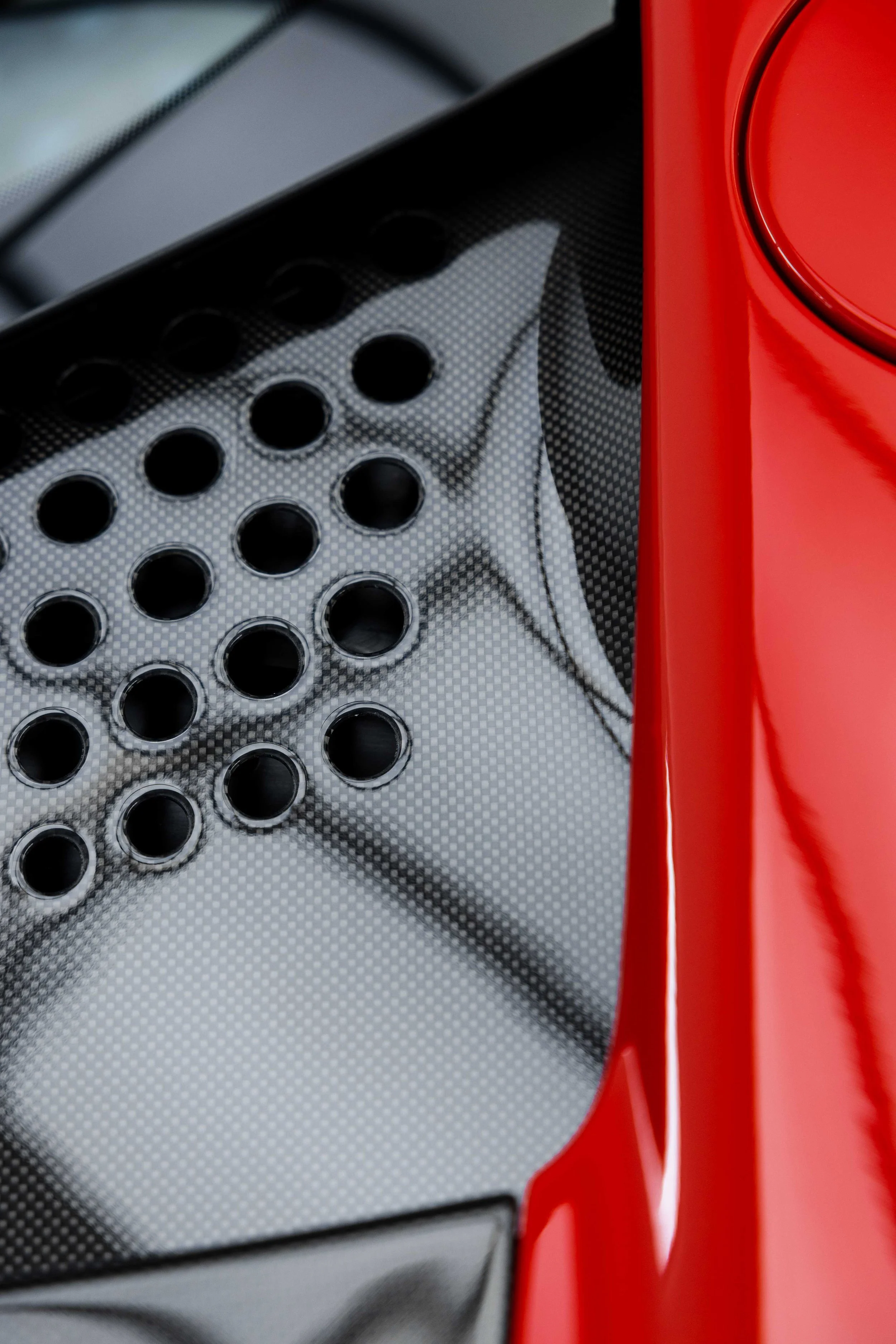 Red Ferrari SF90 Spyder carbon engine cover detail and rear guard with XPEL Paint Protection Film in Mona Vale