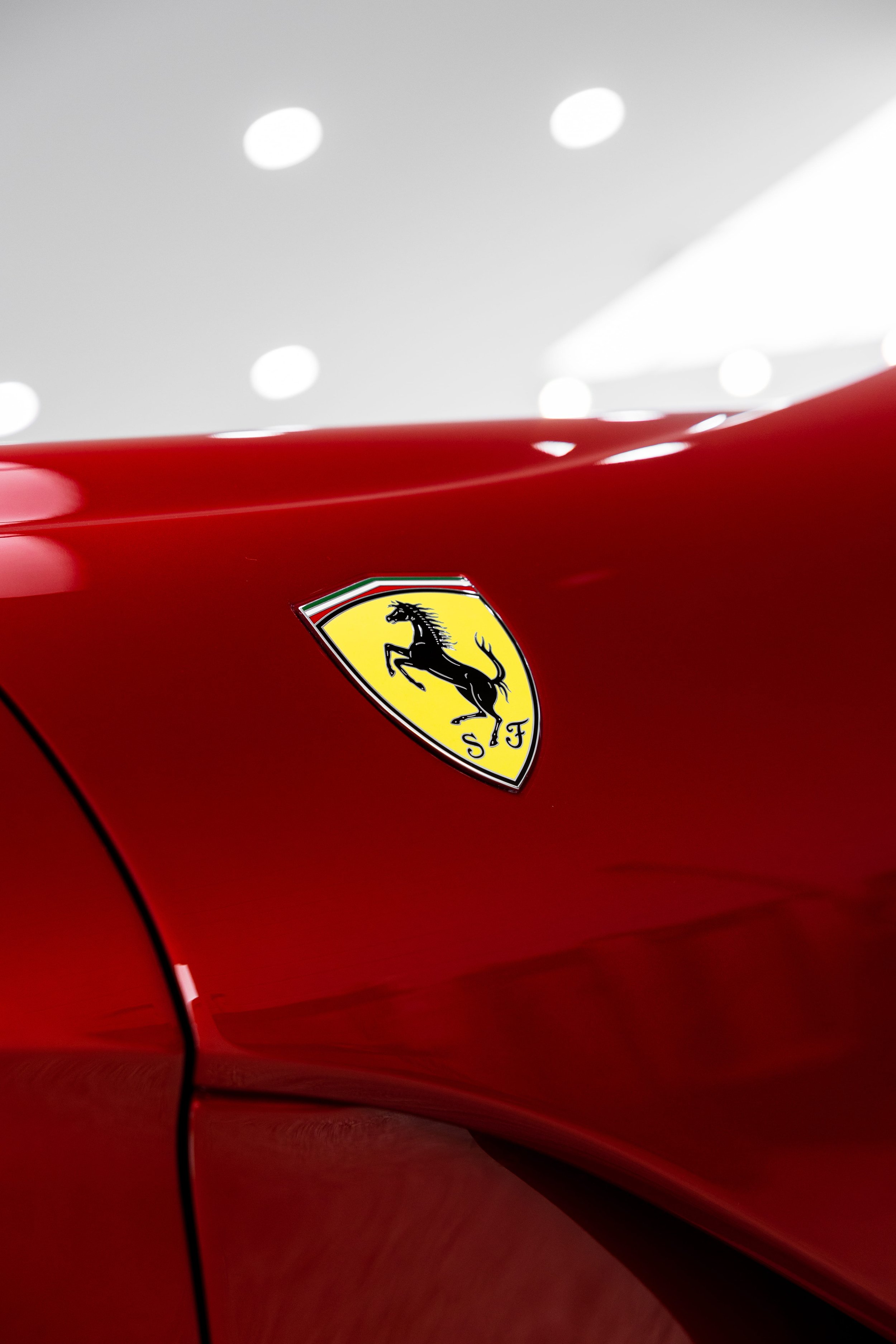 Red Ferrari 812 GTS fender badge detail with Scuderia Ferrari shield protected by PPF and ceramic coating by ADS in Sydney