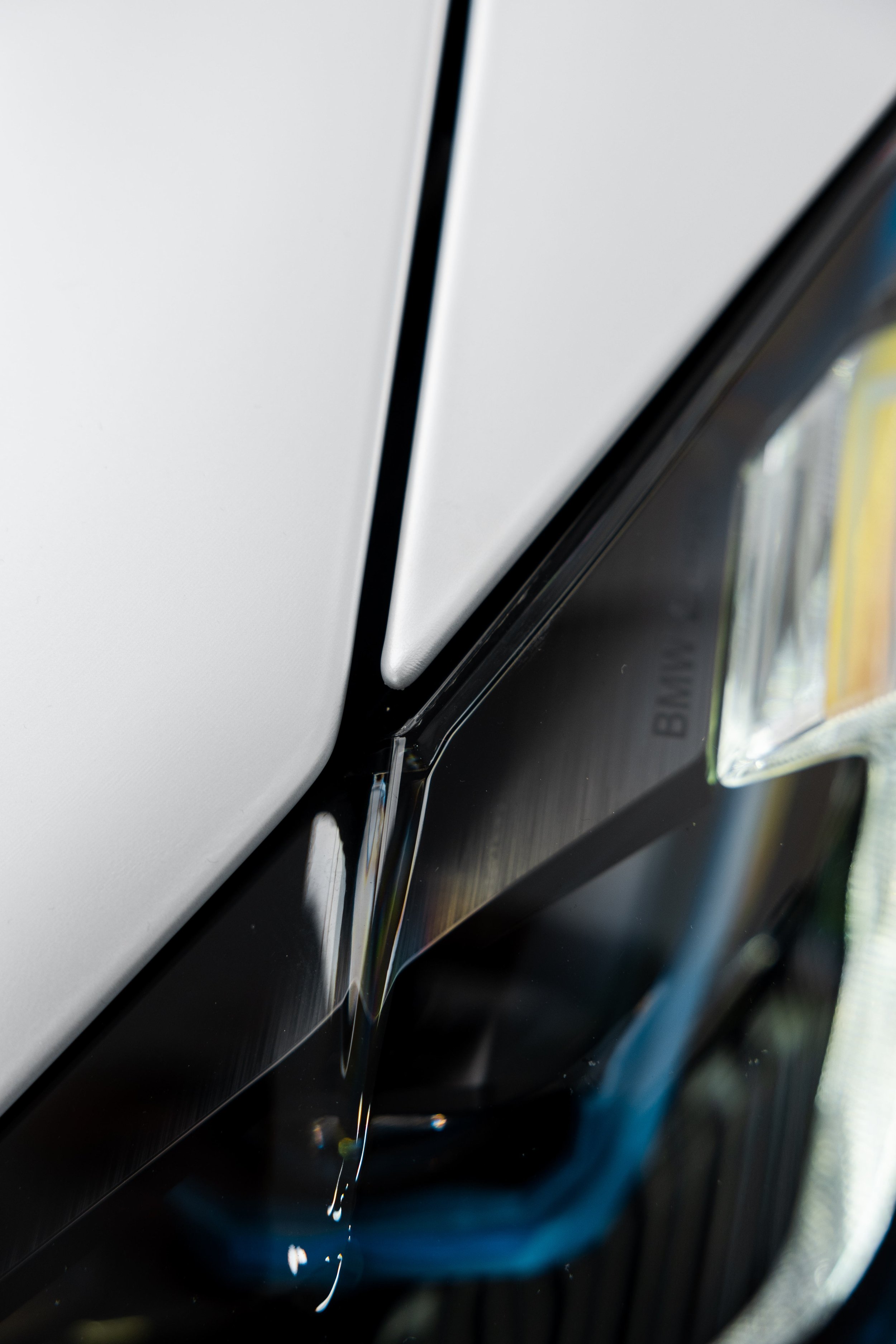 Ceramic coating being applied to white BMW M4 Competition door in Sydney
