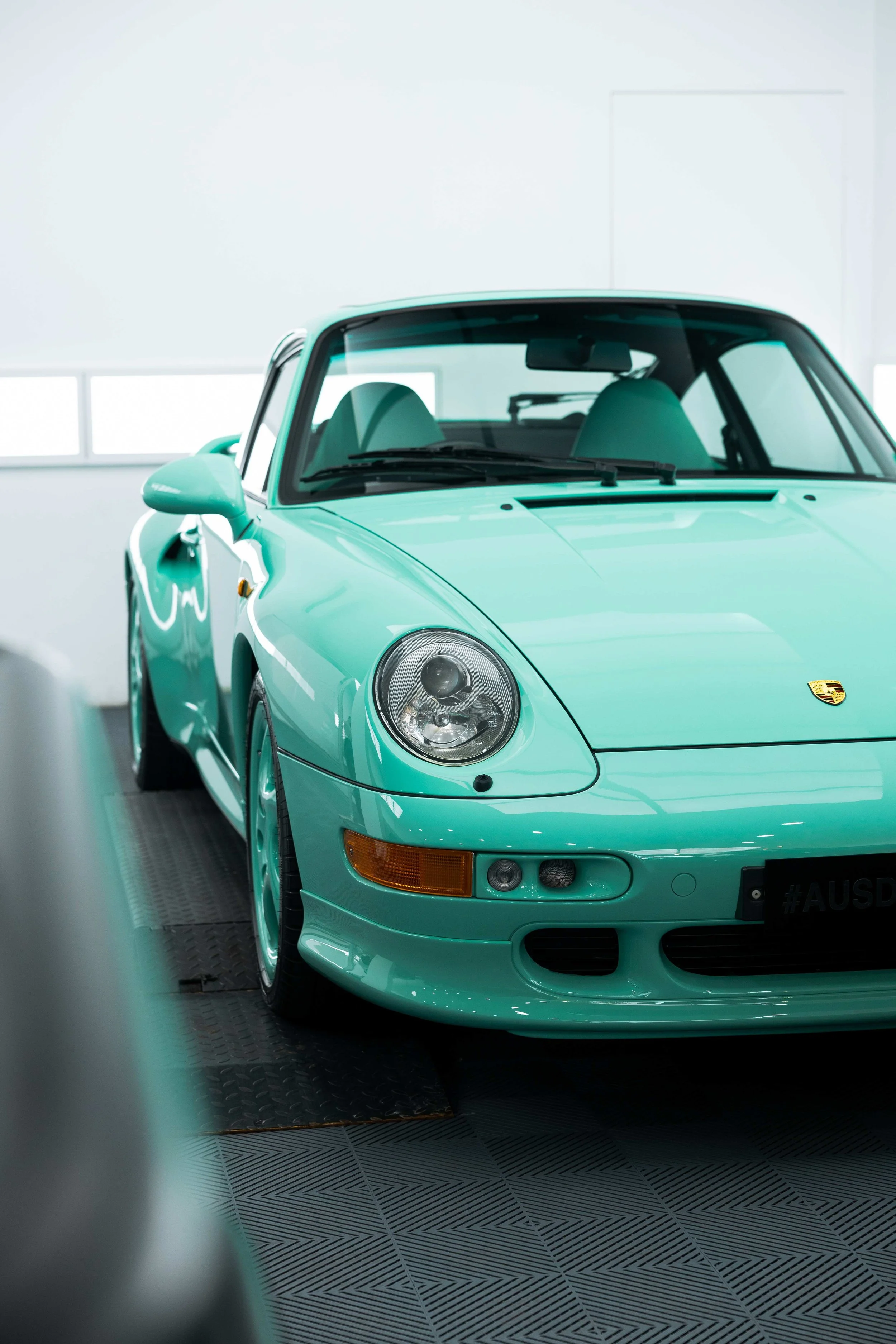 Mint green Porsche 993 front three quarter view with XPEL Paint Protection Film in Sydney