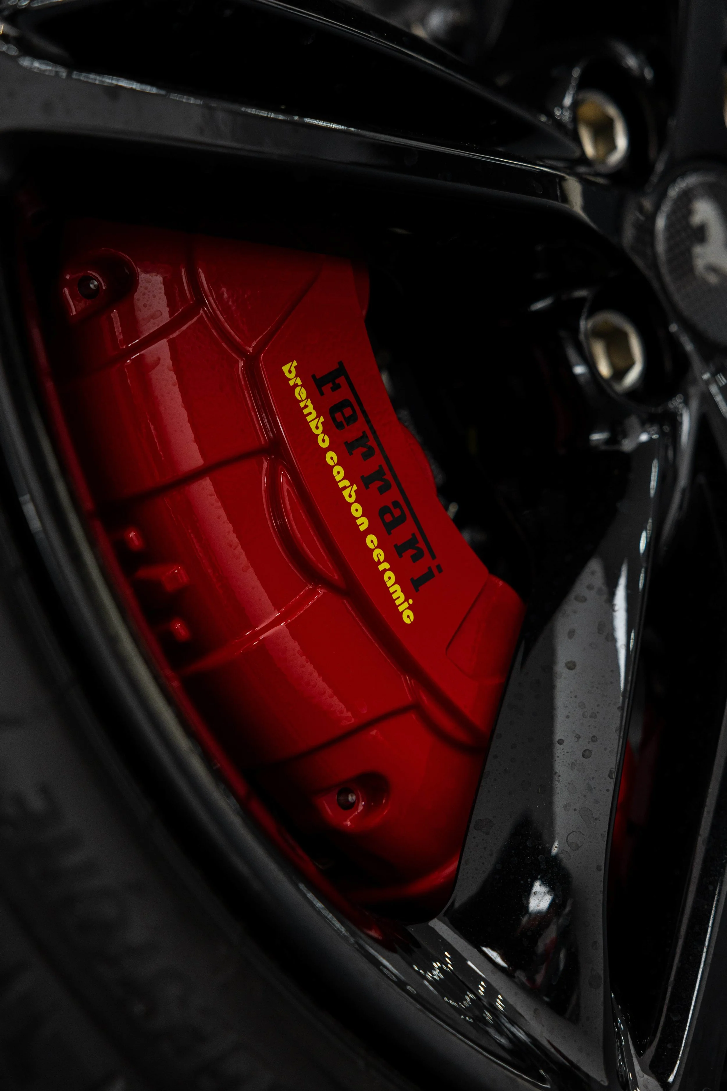 Red Ferrari 296 GTS red brake caliper and wheel detail with XPEL Paint Protection Film in Sydney