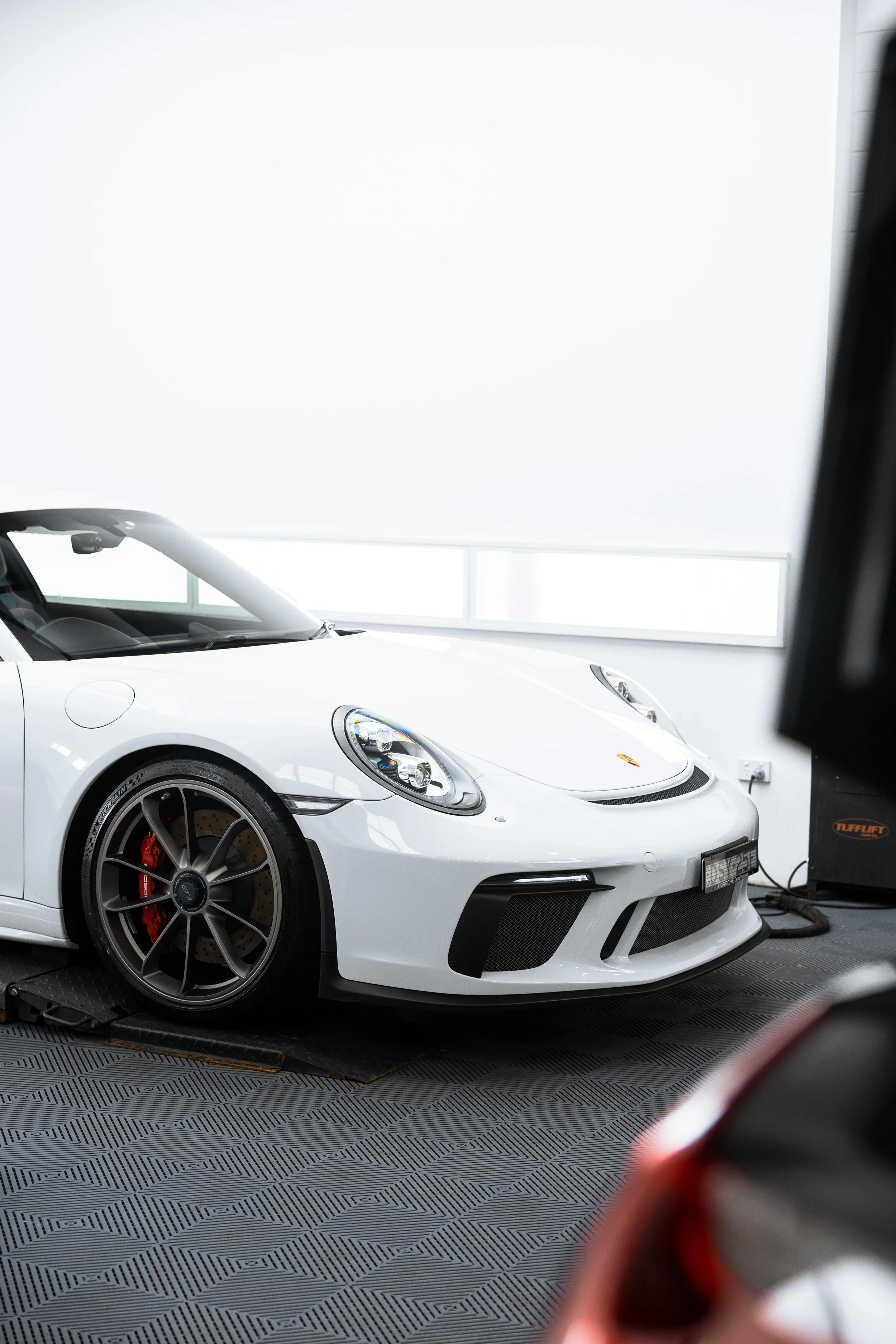 White Porsche GT3 front quarter roof down with XPEL Paint Protection Film in Mona Vale