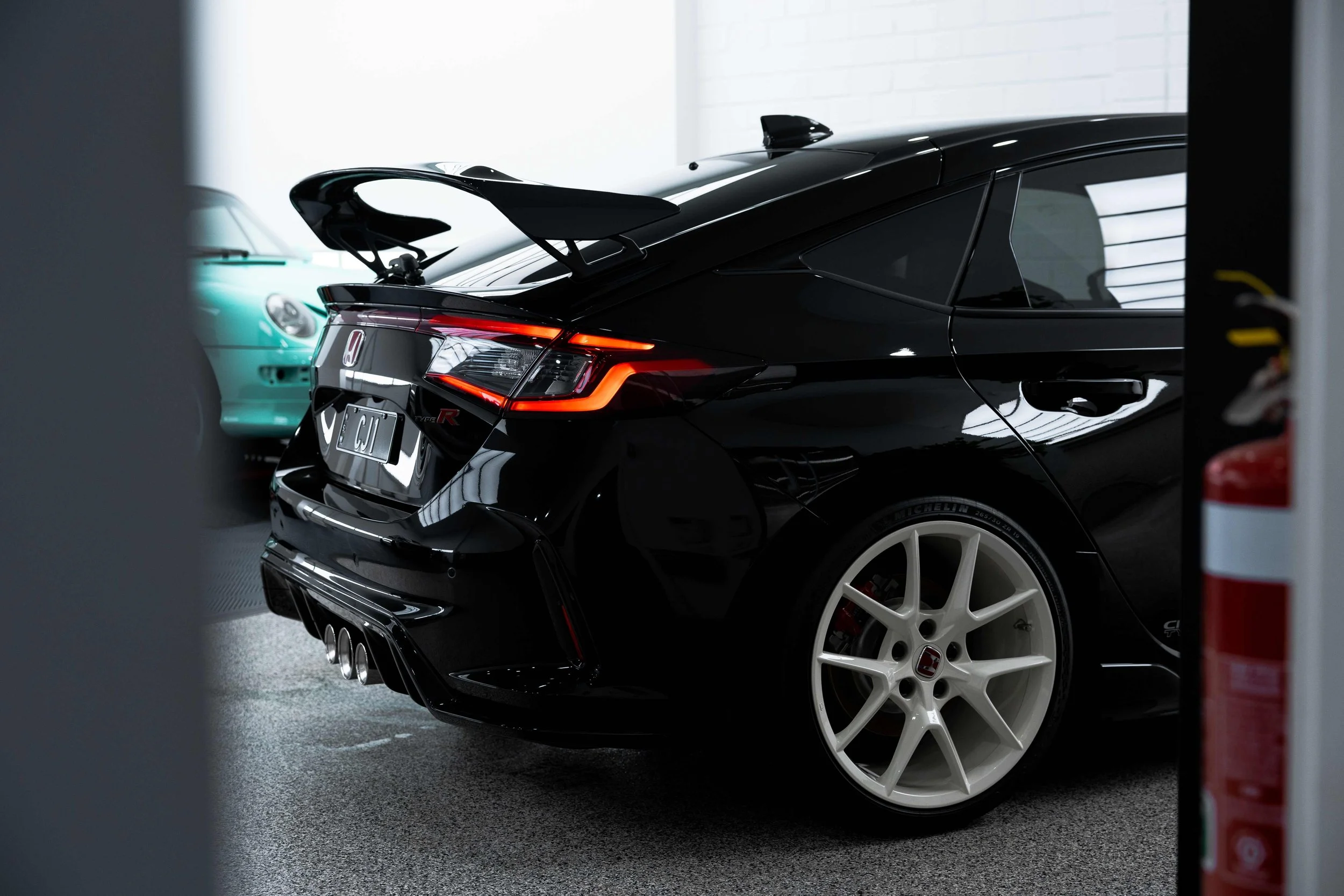 Black Honda Civic Type R rear quarter and wheel with XPEL Paint Protection Film in Sydney
