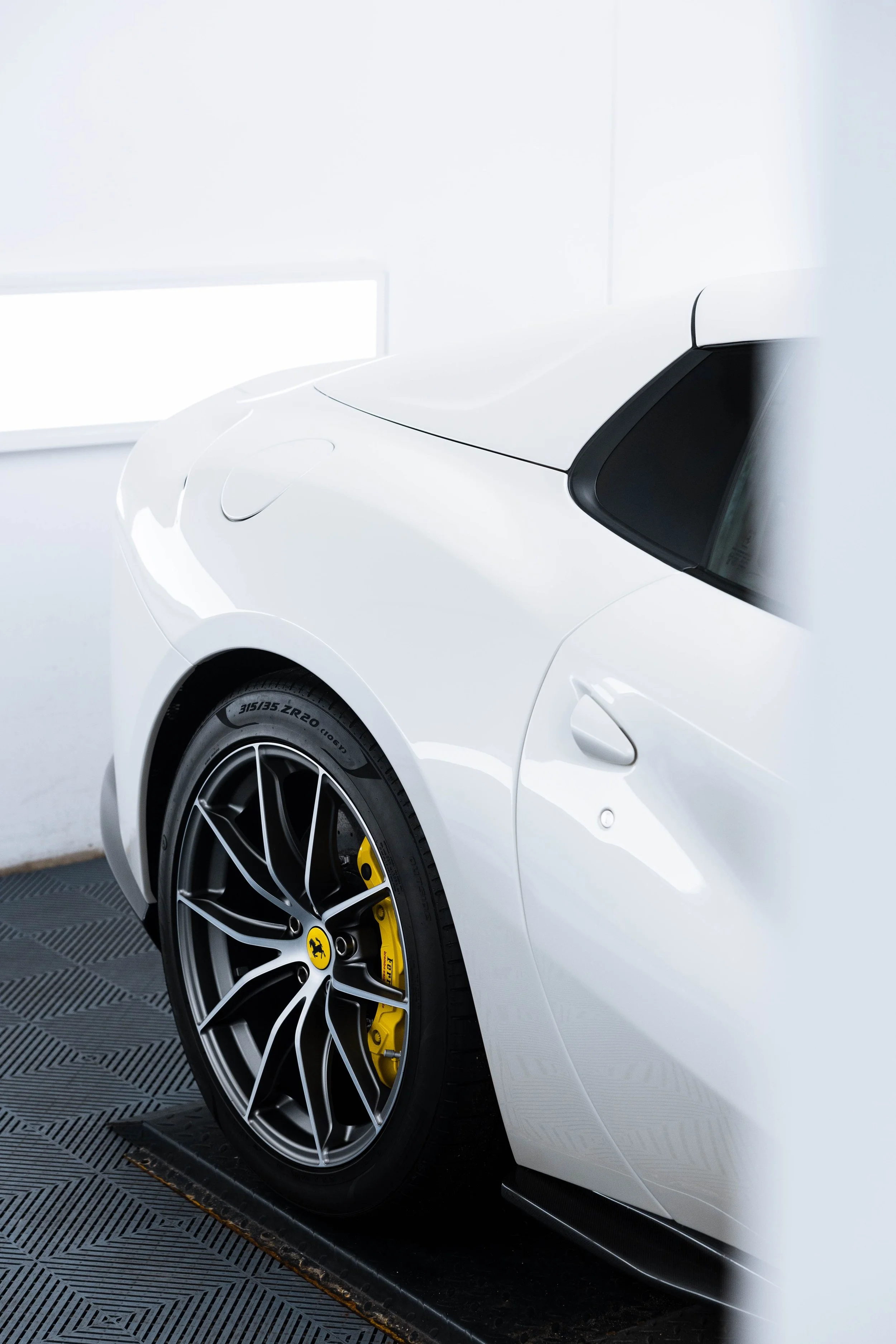 White Ferrari 812 GTS rear quarter panel and wheel with XPEL Paint Protection Film in Mona Vale