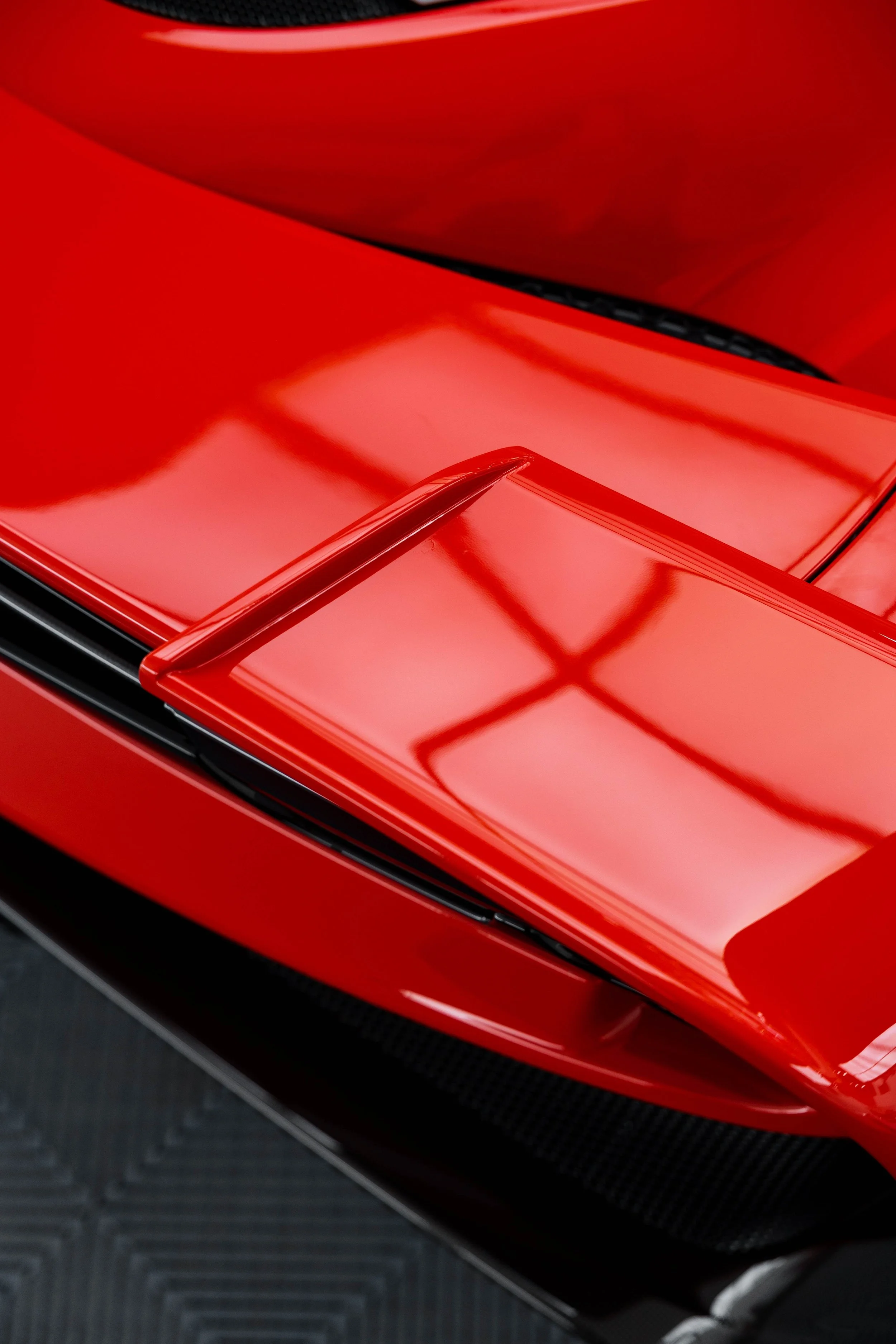 Red Ferrari 296 Speciale rear wing edge and taillight with XPEL Paint Protection Film in Sydney