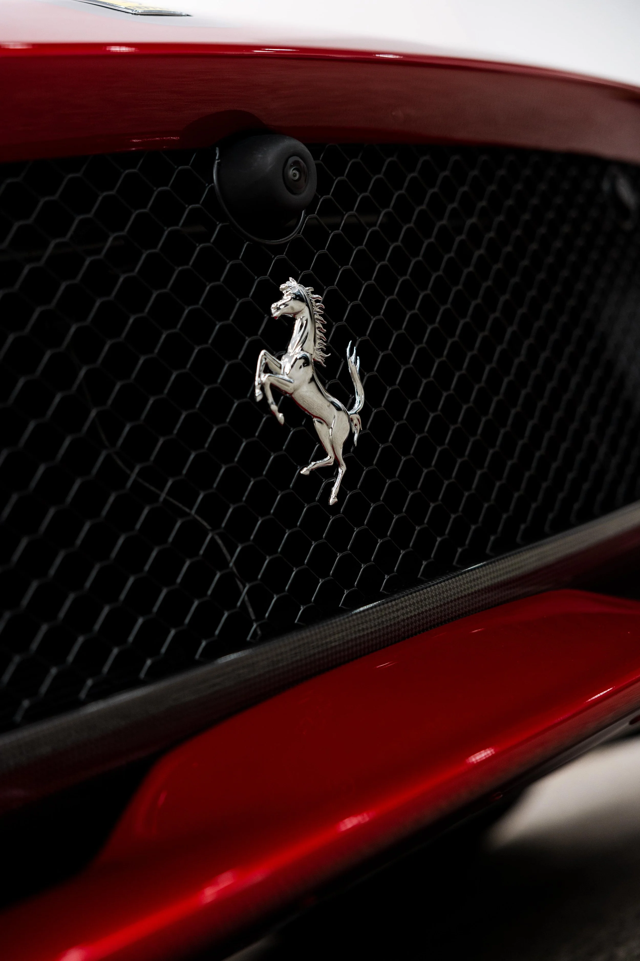 Red Ferrari 812 GTS grille and Prancing Horse emblem with XPEL Paint Protection Film in Mona Vale