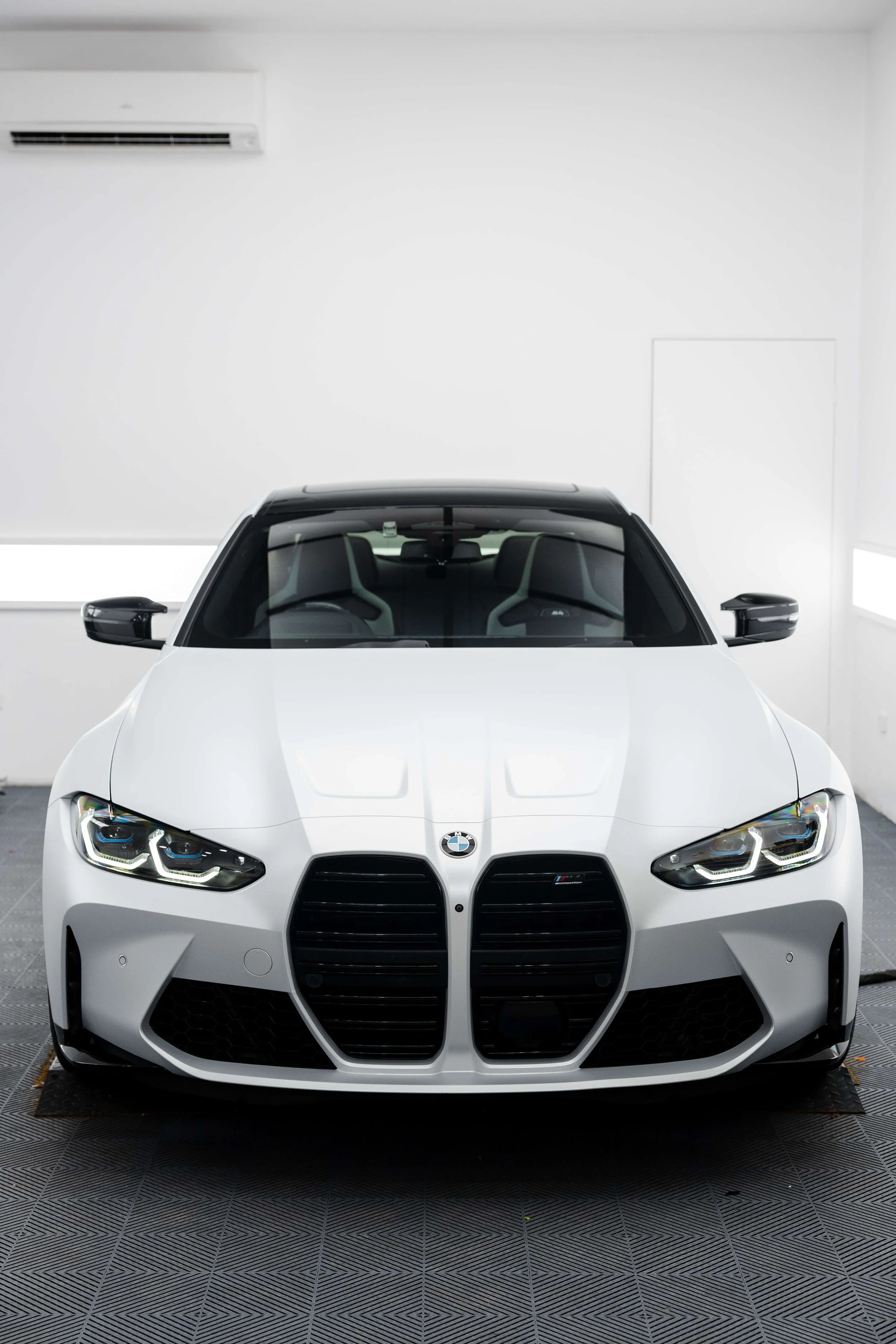 White BMW M4 Competition front grille with XPEL Paint Protection Film in Mona Vale