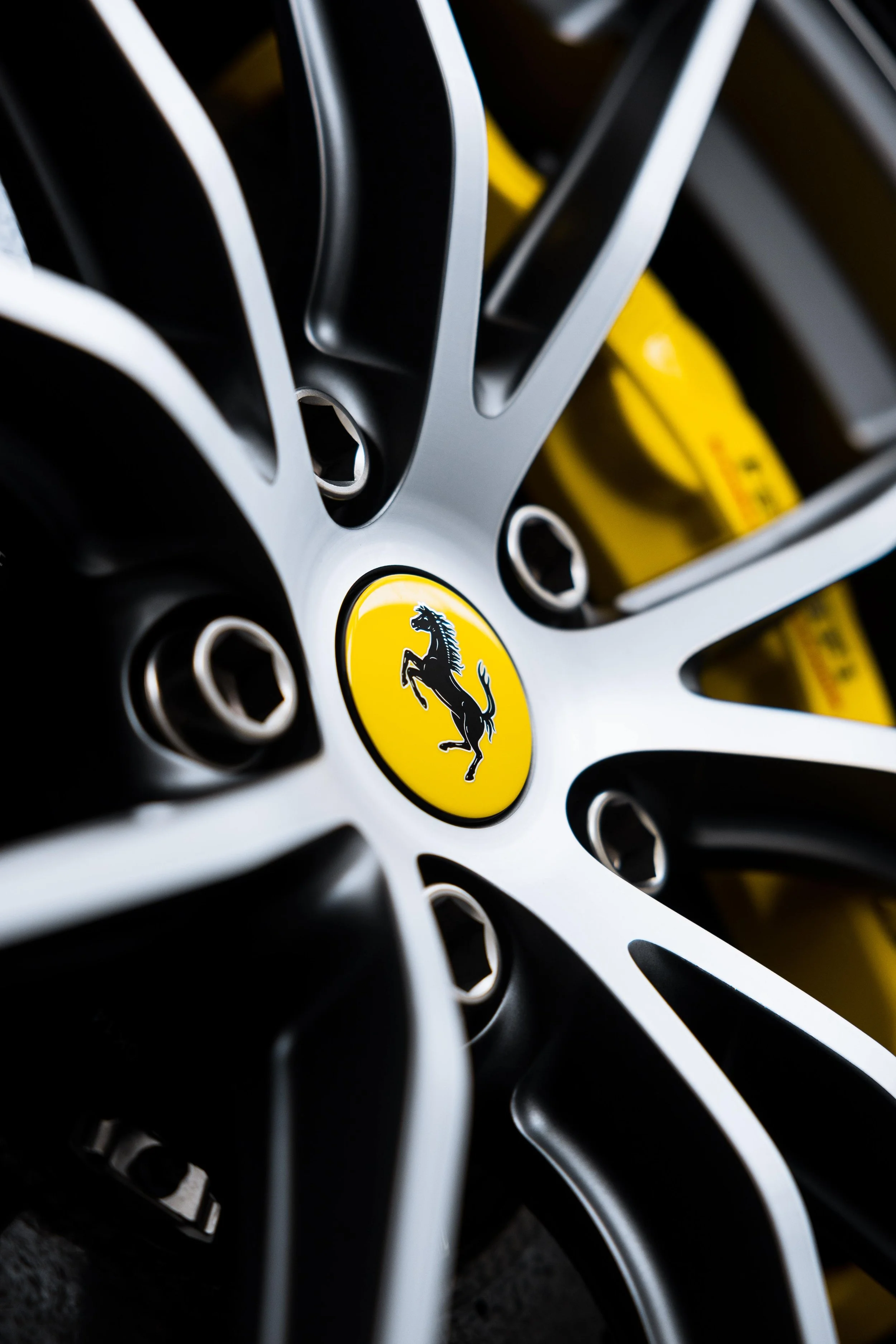 White Ferrari 812 GTS wheel centre cap and Ferrari badge with XPEL Paint Protection Film in Sydney
